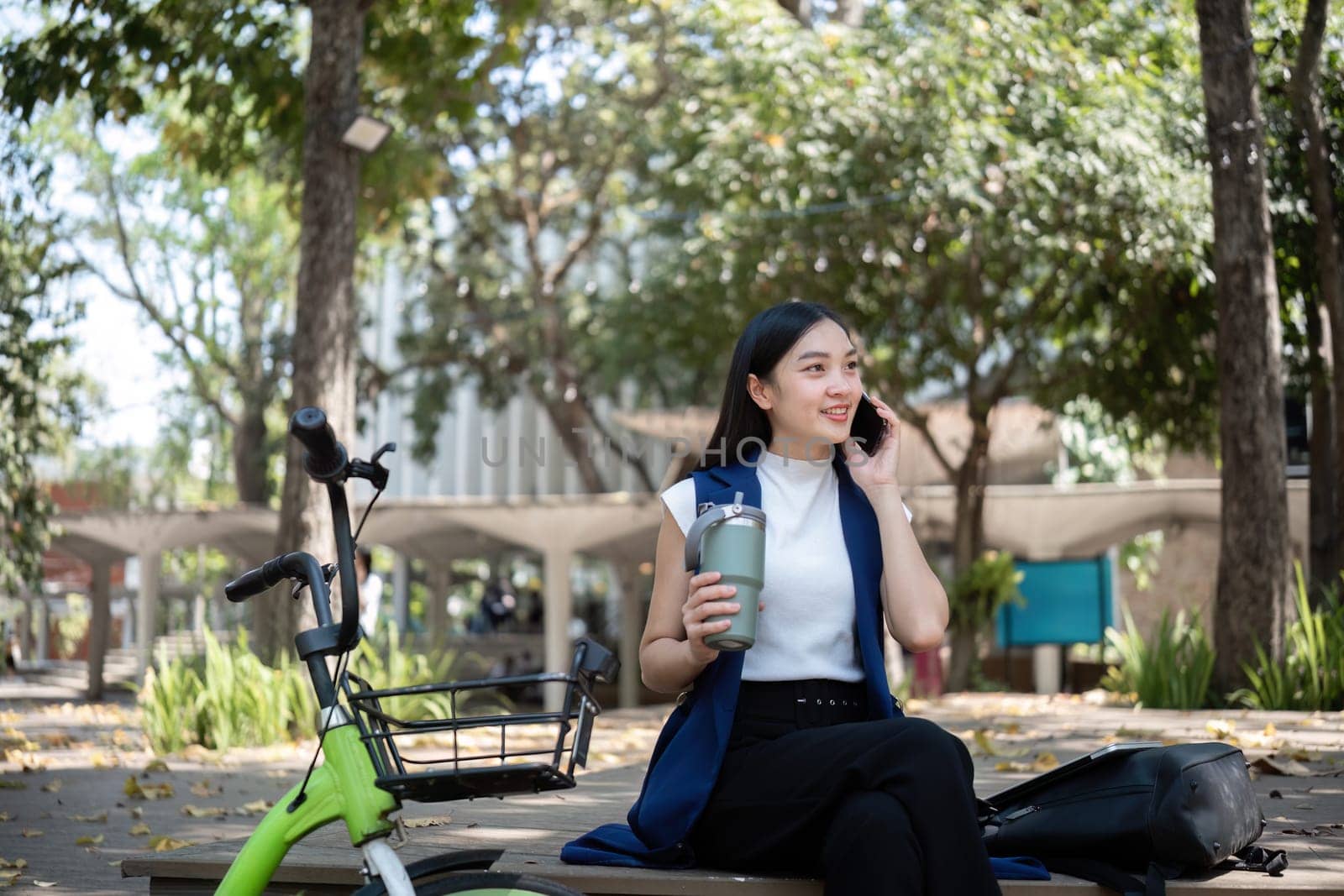 A young woman enjoys a bike ride promoting clean energy and reducing pollution in her city.