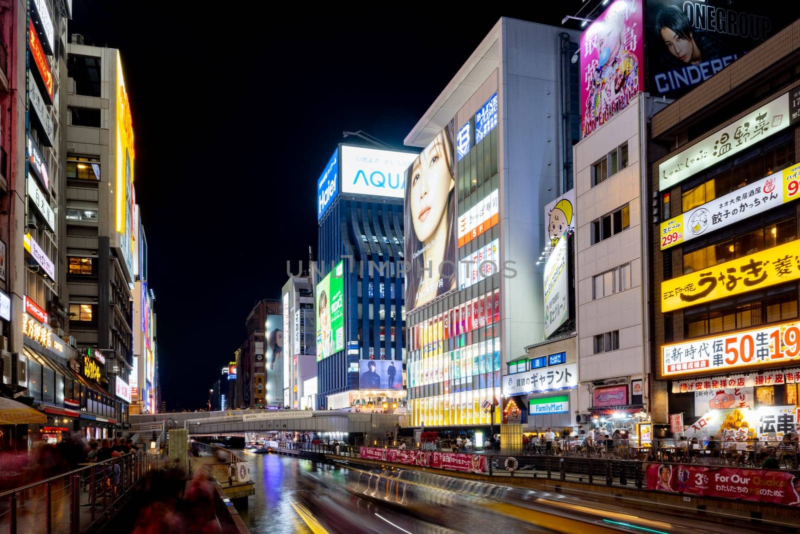 OSAKA, JAPAN - SEPTEMBER 26 2024: The view down Dotonbori River from Ebisubashi Bridge on a clear autumn day in Osaka, Japan