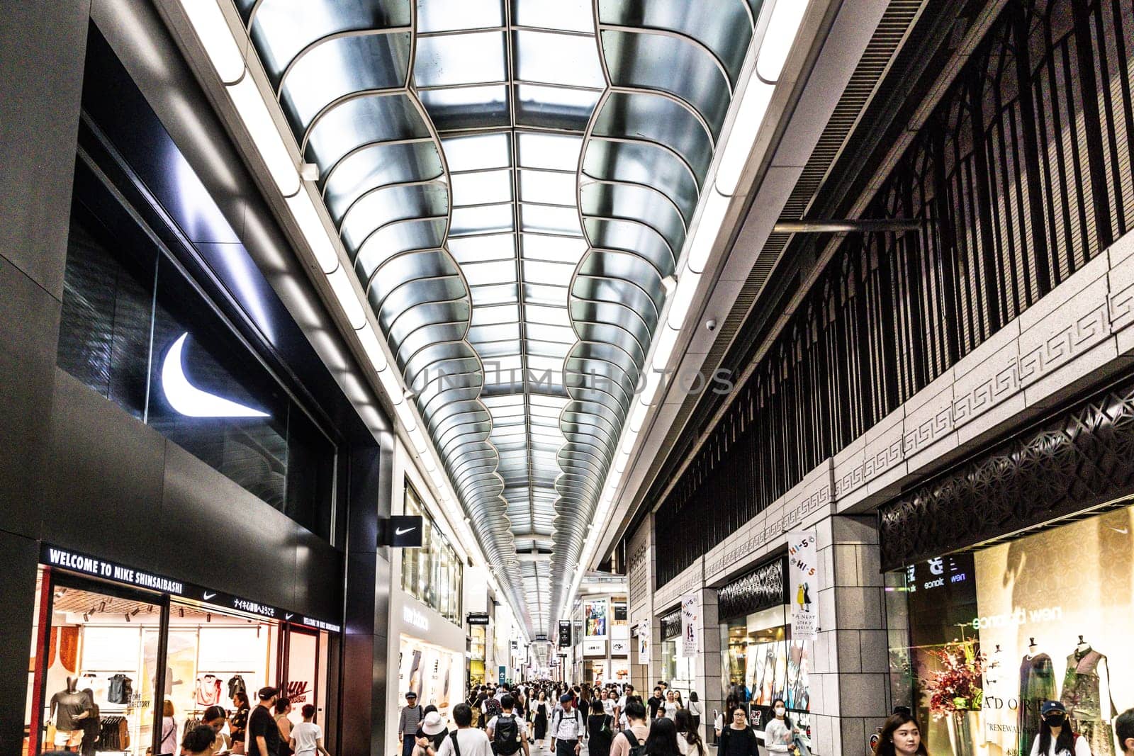 OSAKA, JAPAN - SEPTEMBER 25 2024: The view inside of the long covered and crowded shopping street, Shin Sai Bashi Suji in Dotonbori, Osaka, Japan