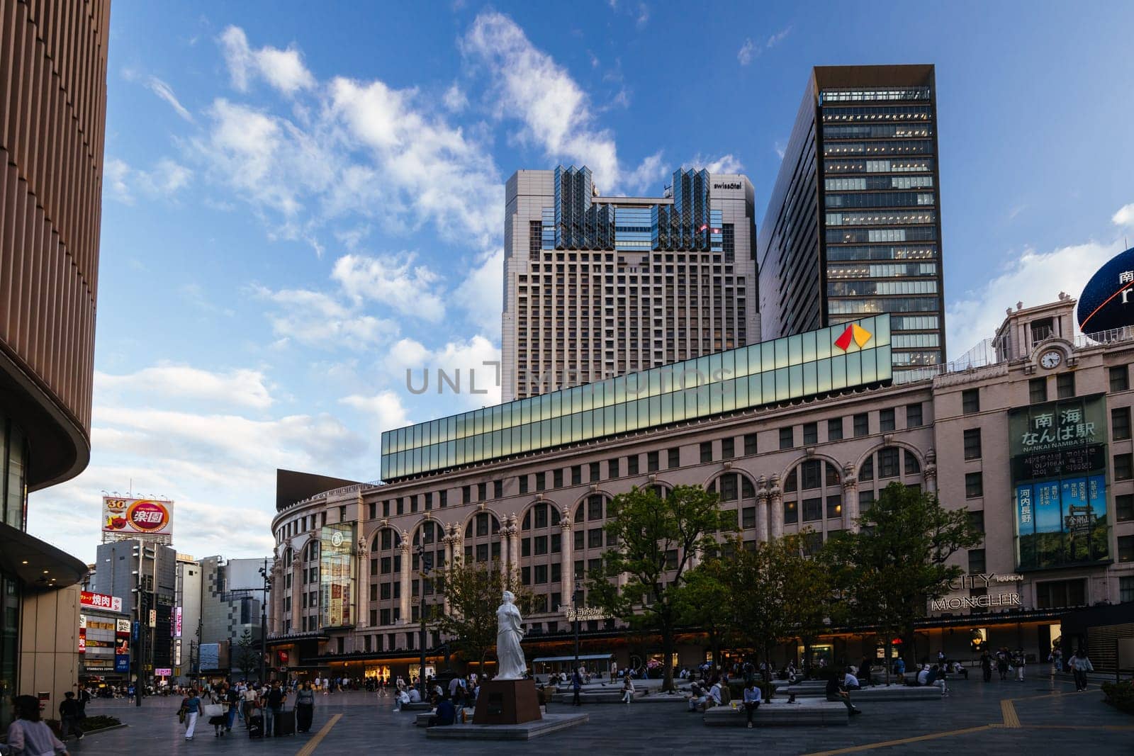 OSAKA, JAPAN - SEPTEMBER 26 2024: Namba Station at dusk, run by the Nankai Electric Company in Chuo, Osaka, Japan