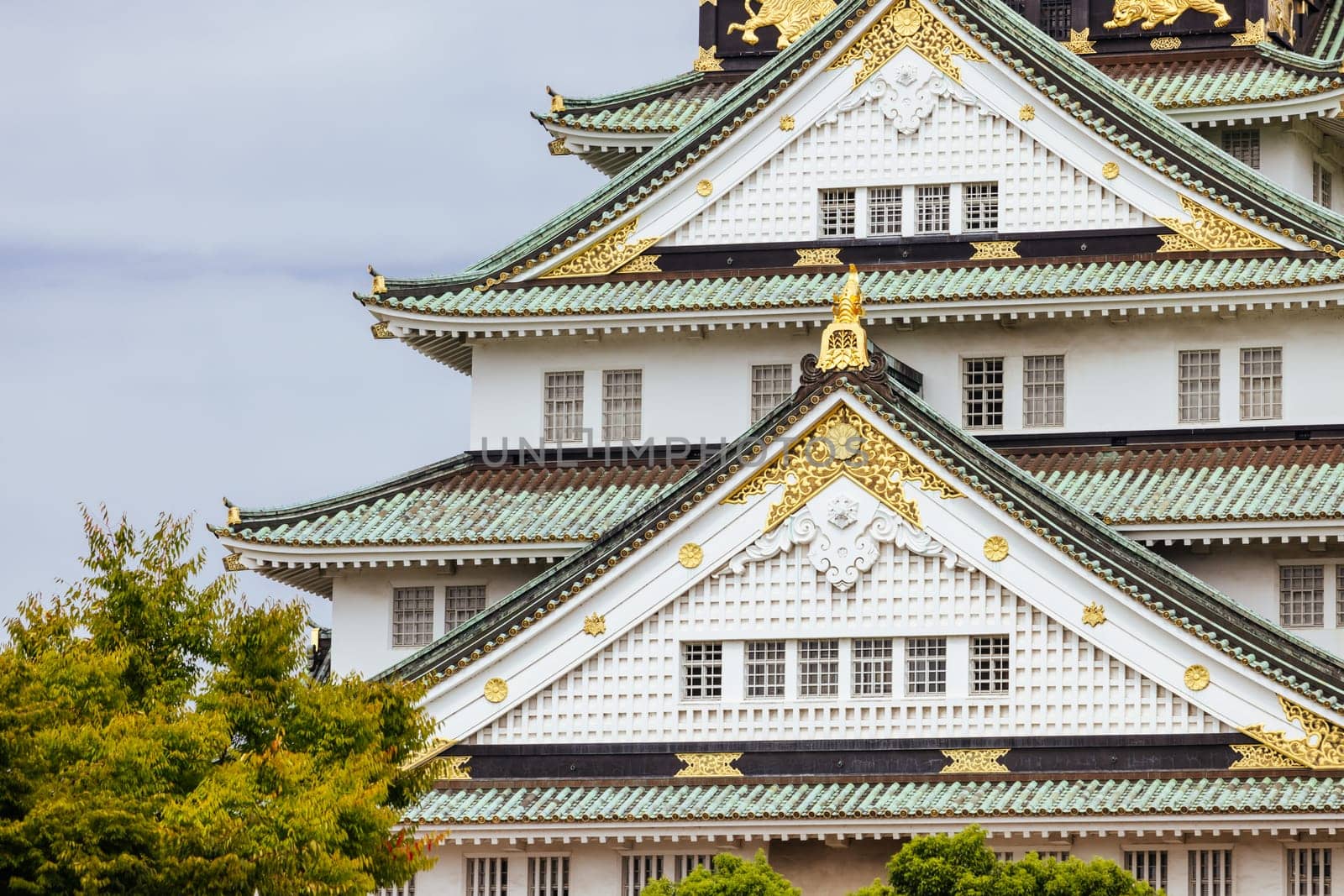 OSAKA, JAPAN - SEPTEMBER 25 2024: The iconic Osaka Castle and lush surrounds on a warm clear autumn day in Osaka, Japan on September 25th 2024