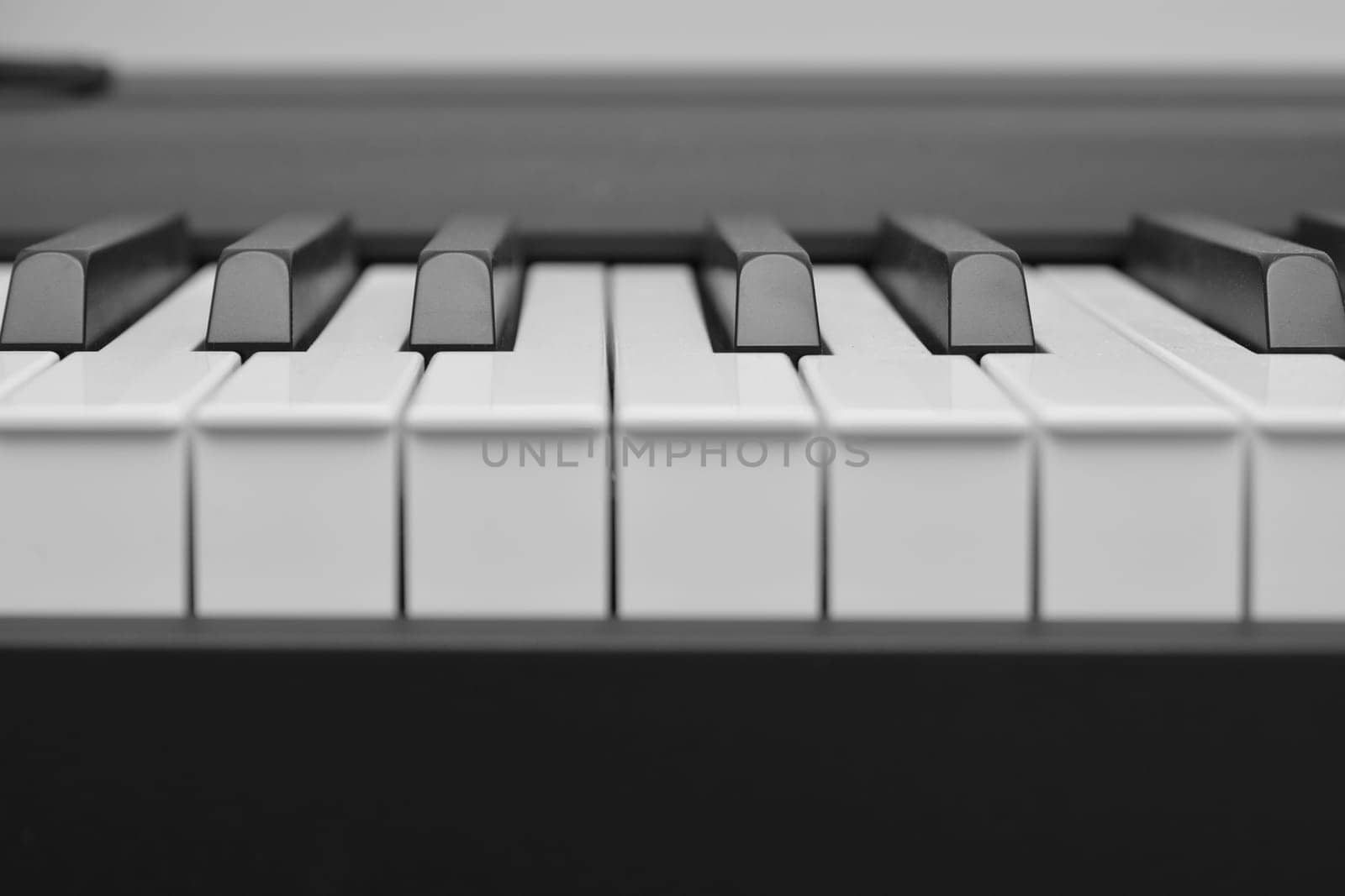 Close up of piano white black keys