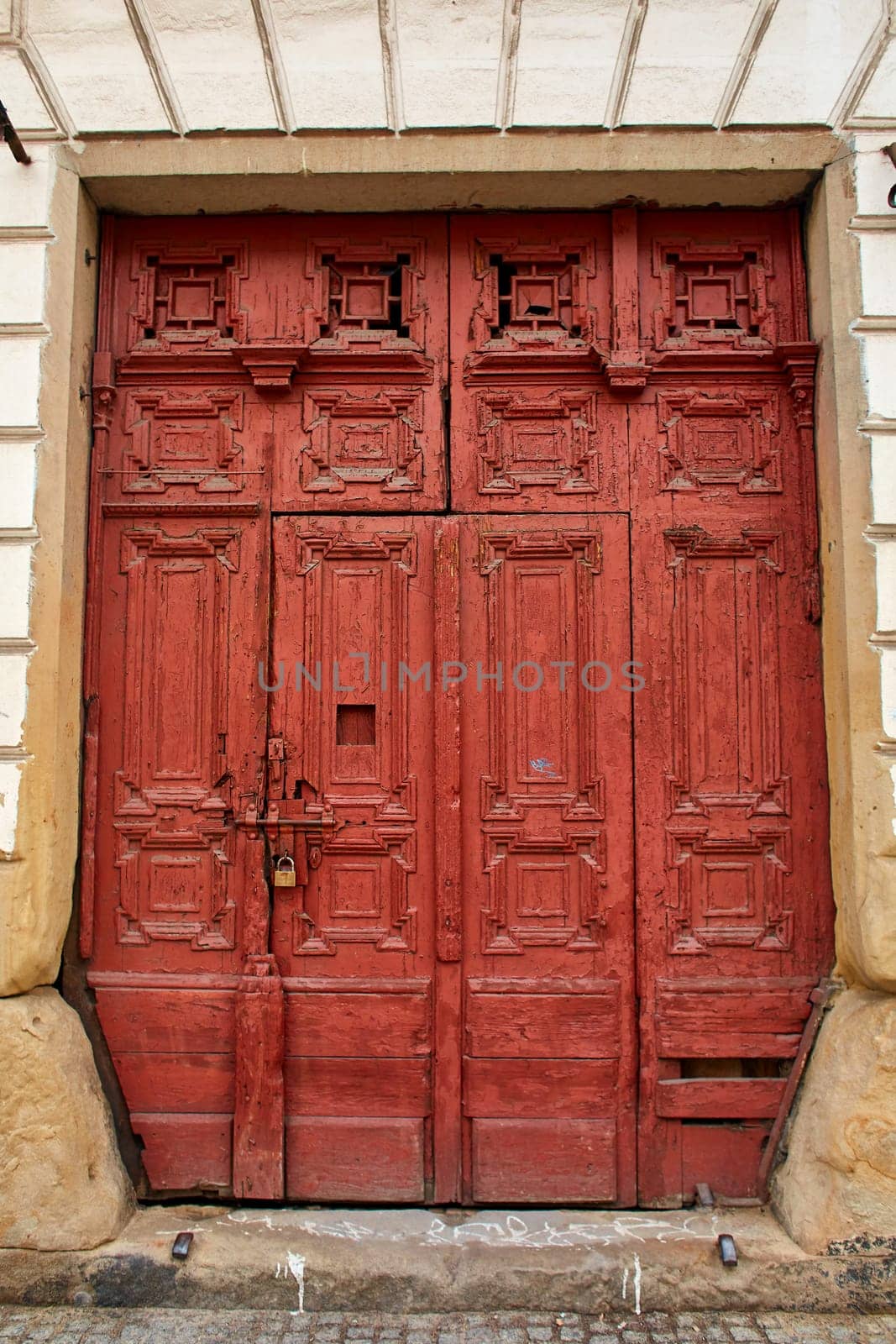 An ancient majestic door in a European city