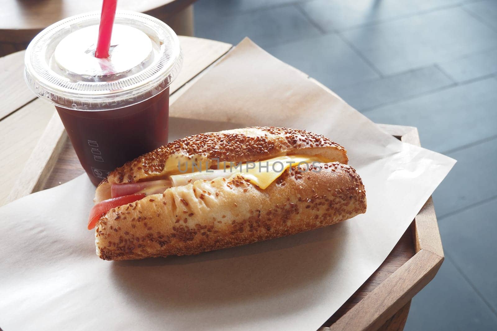 A delicious and tasty sandwich paired with a refreshing beverage on a casual dining table