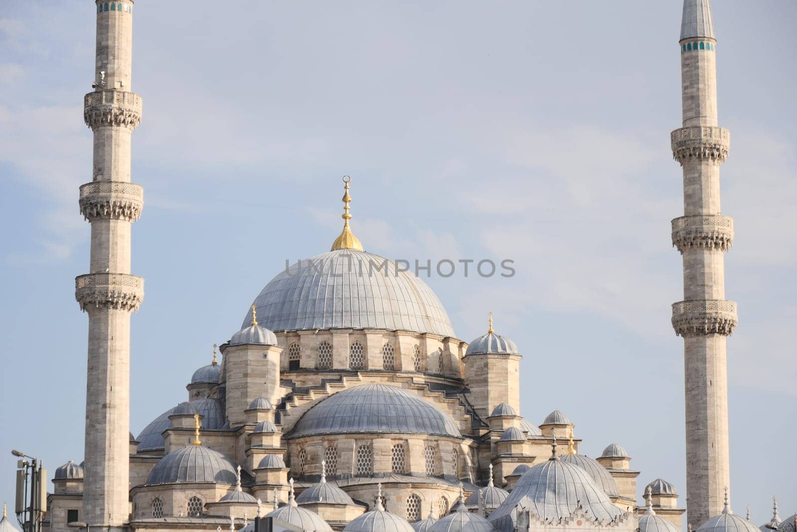 A breathtaking view showcases a grand mosque featuring its majestic domes and towering minarets