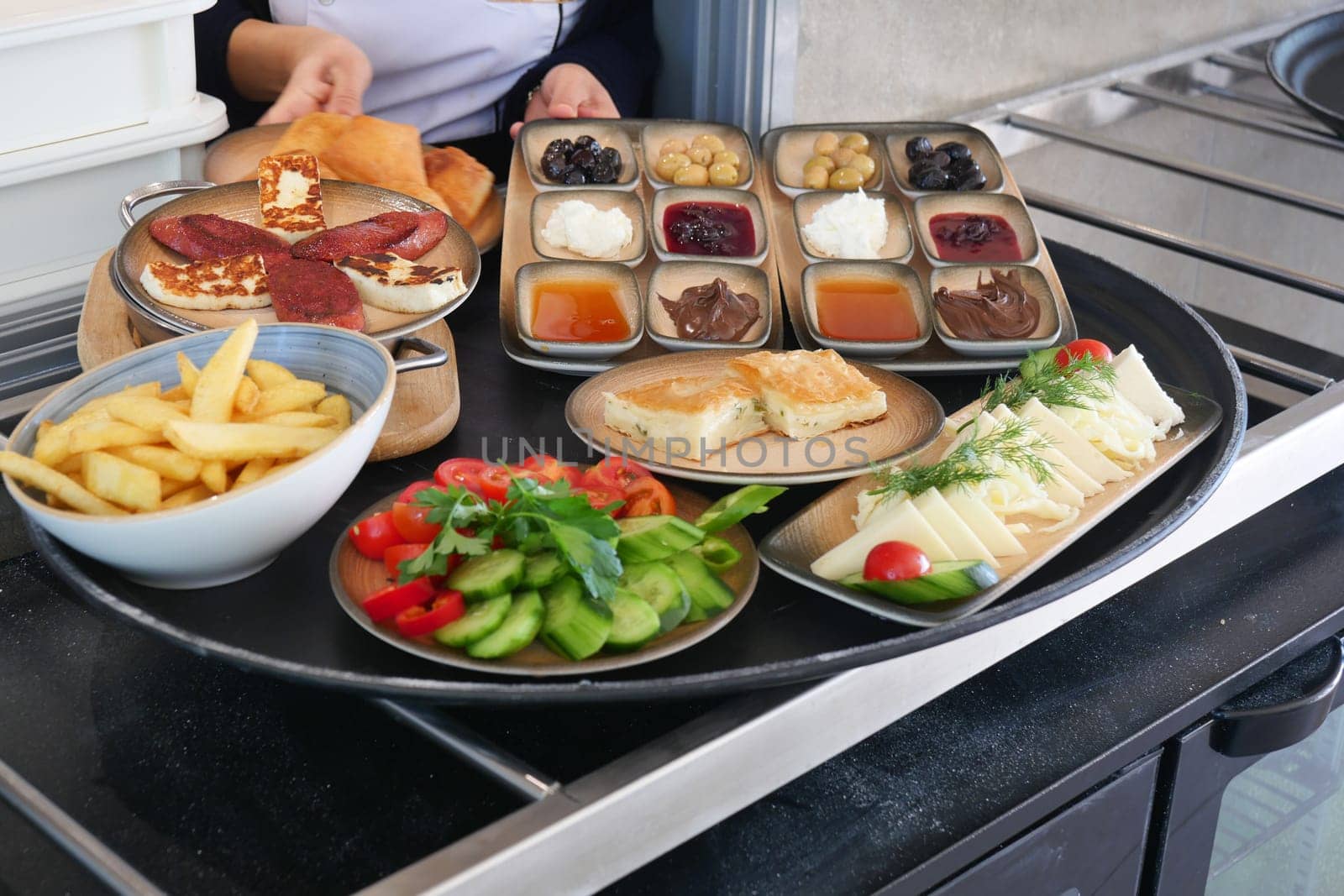 An appealing presentation of Mediterranean dishes, fresh salads, and delightful sides