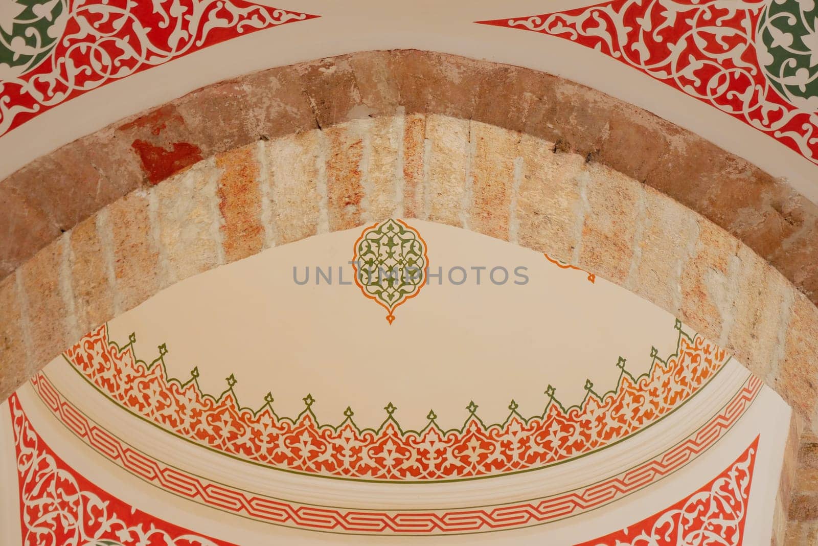 The detailed Moroccan archway features vivid colors and intricate patterns that captivate