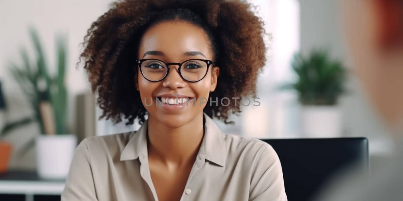 Stylish confident adult 30 years old african american female psychologist sitting arms crossed looking at camera. AI Generated
