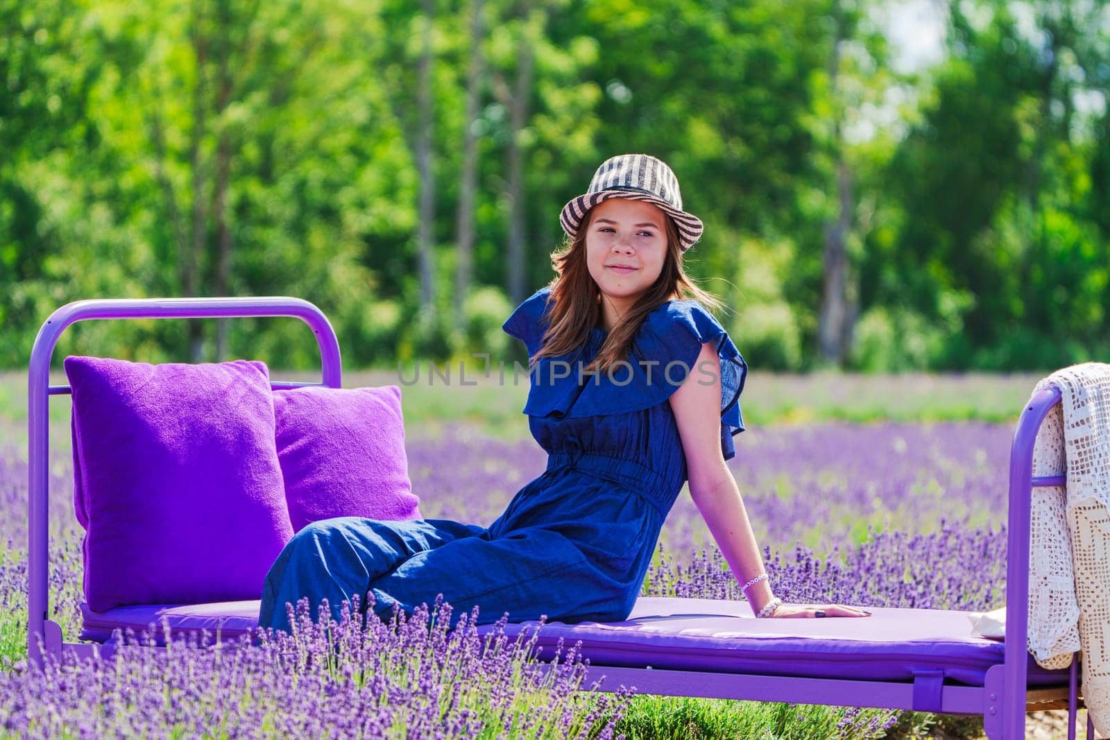 Enchanting Elegance: A Beautiful Girl amidst Lavender Fields. A Dreamy Summer Photo Session in the Lavender Field