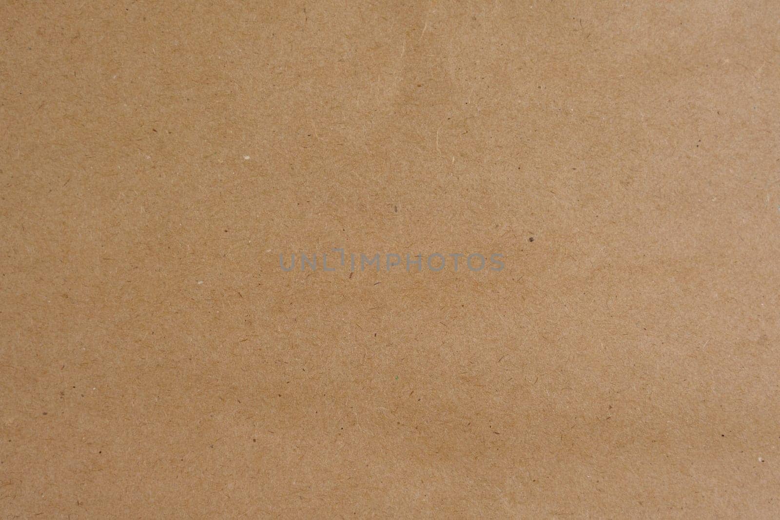 Blank kraft paper background with natural texture, ideal for use in design, crafting, or as a rustic and simple backdrop, no people.