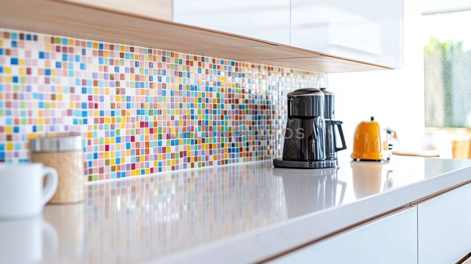 Gleaming white countertop in a modern kitchen, featuring vibrant mosaic tiles and essential appliances, creating a stylish and functional space