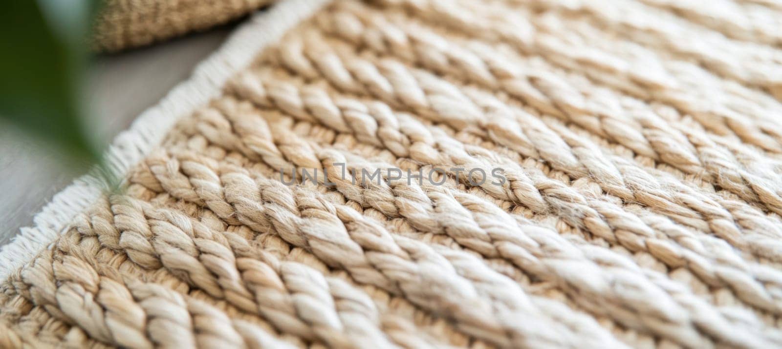 Close up of a jute rug highlighting the woven texture and natural fibers, creating a warm and inviting atmosphere
