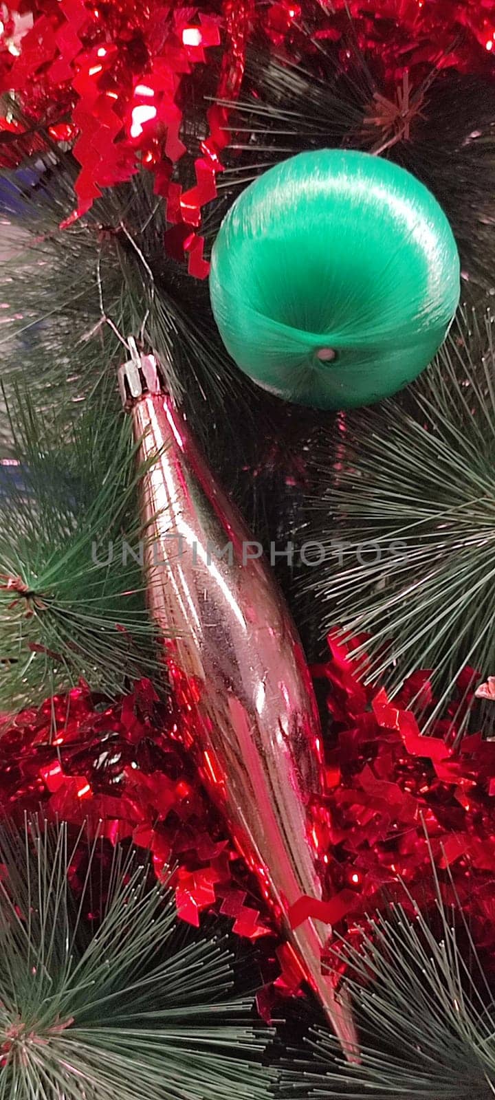 new year red toys for christmas tree, green branch holiday objects decoration decor decorations. High quality photo