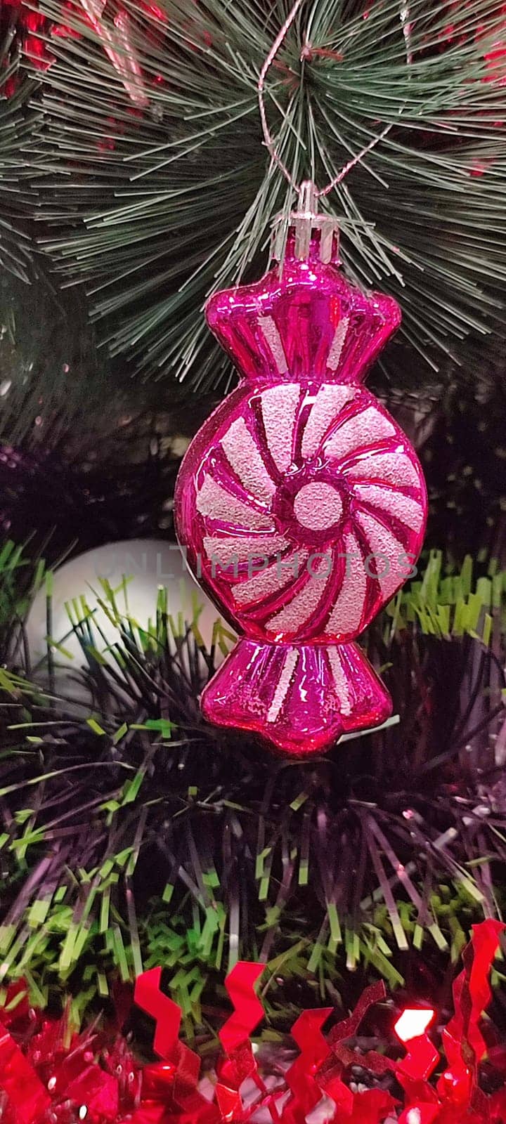 new year red toys for christmas tree, green branch holiday objects decoration decor decorations. High quality photo