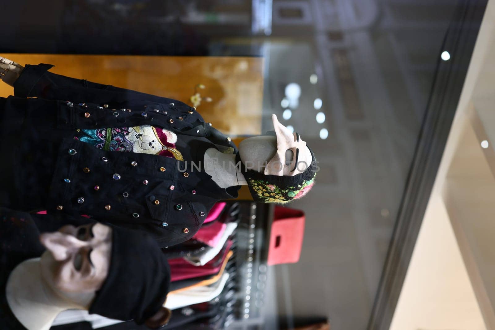 Stylish mannequins elegantly showcasing a variety of modern clothing and accessories in an inviting retail setting
