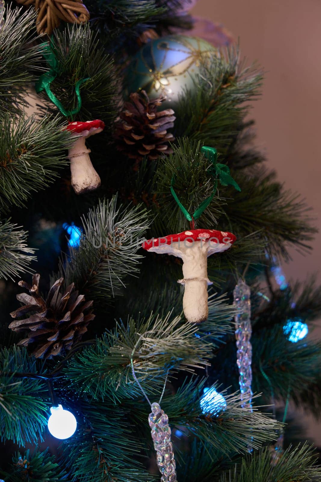 Colorful and vibrant mushroom ornaments beautifully highlight and enhance a wonderfully decorated Christmas tree