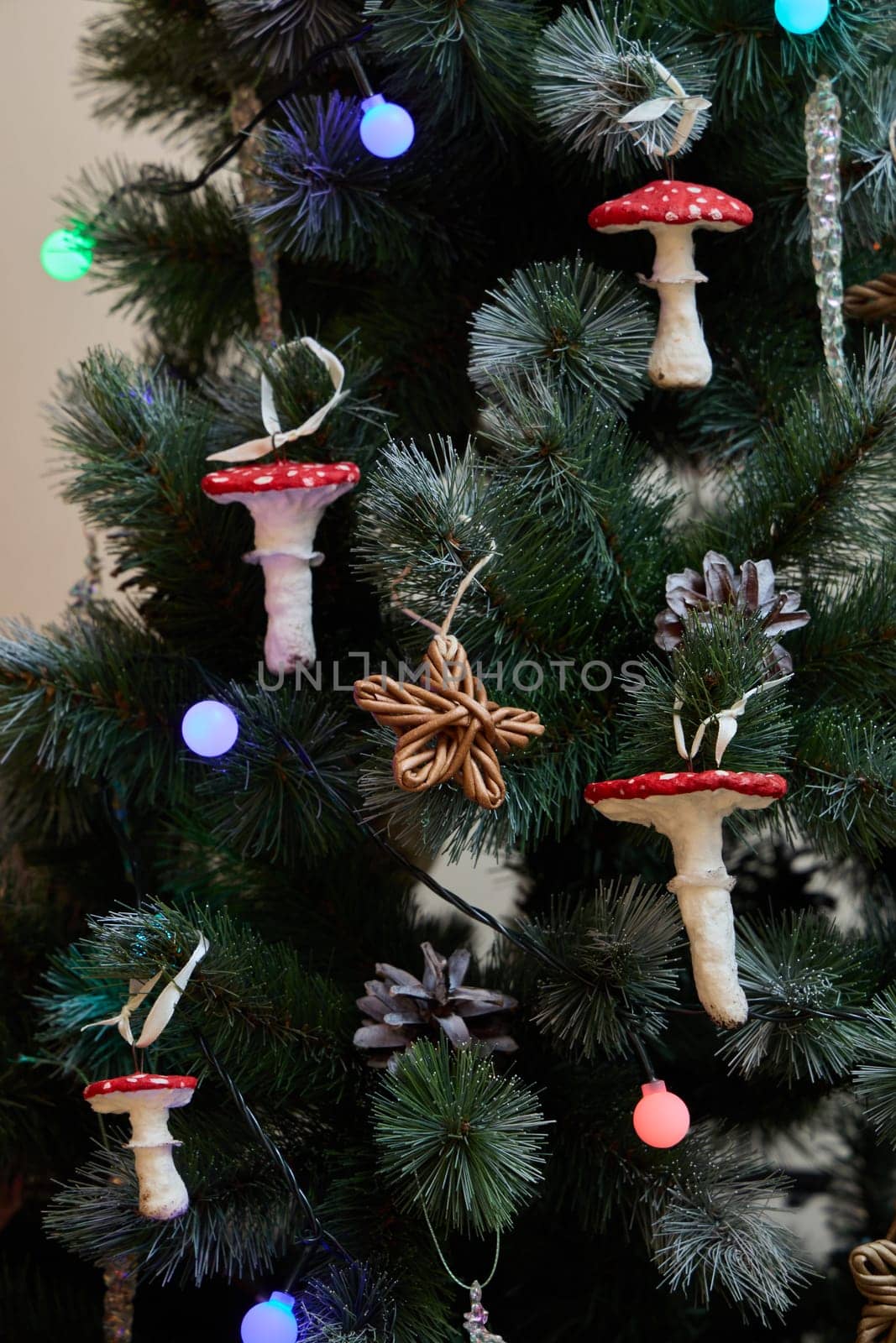 A beautifully festive Christmas tree that is adorned with charming mushroom ornaments and twinkling colorful lights