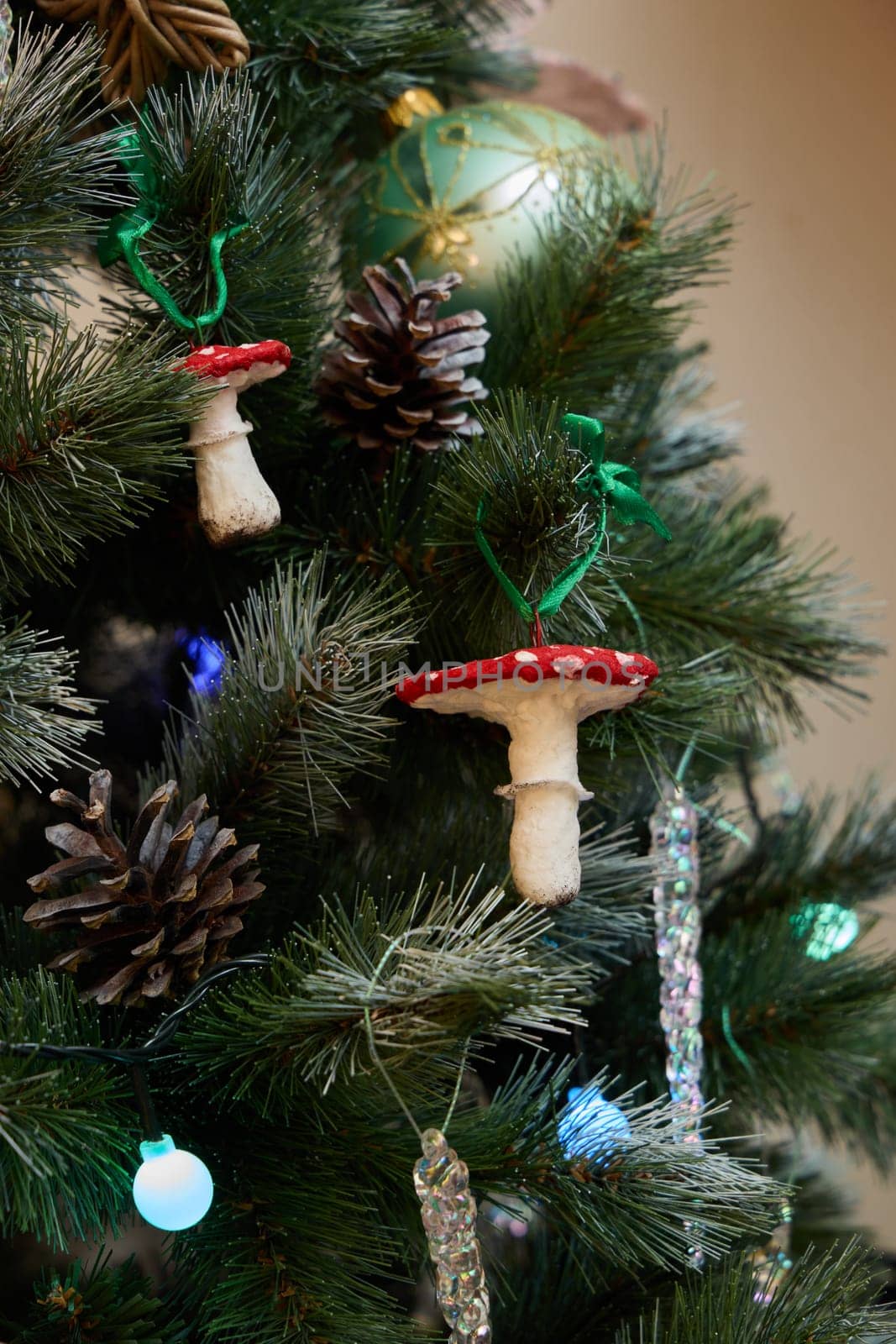 A beautifully decorated Christmas tree with charming mushroom ornaments and rustic pinecones, festive this season