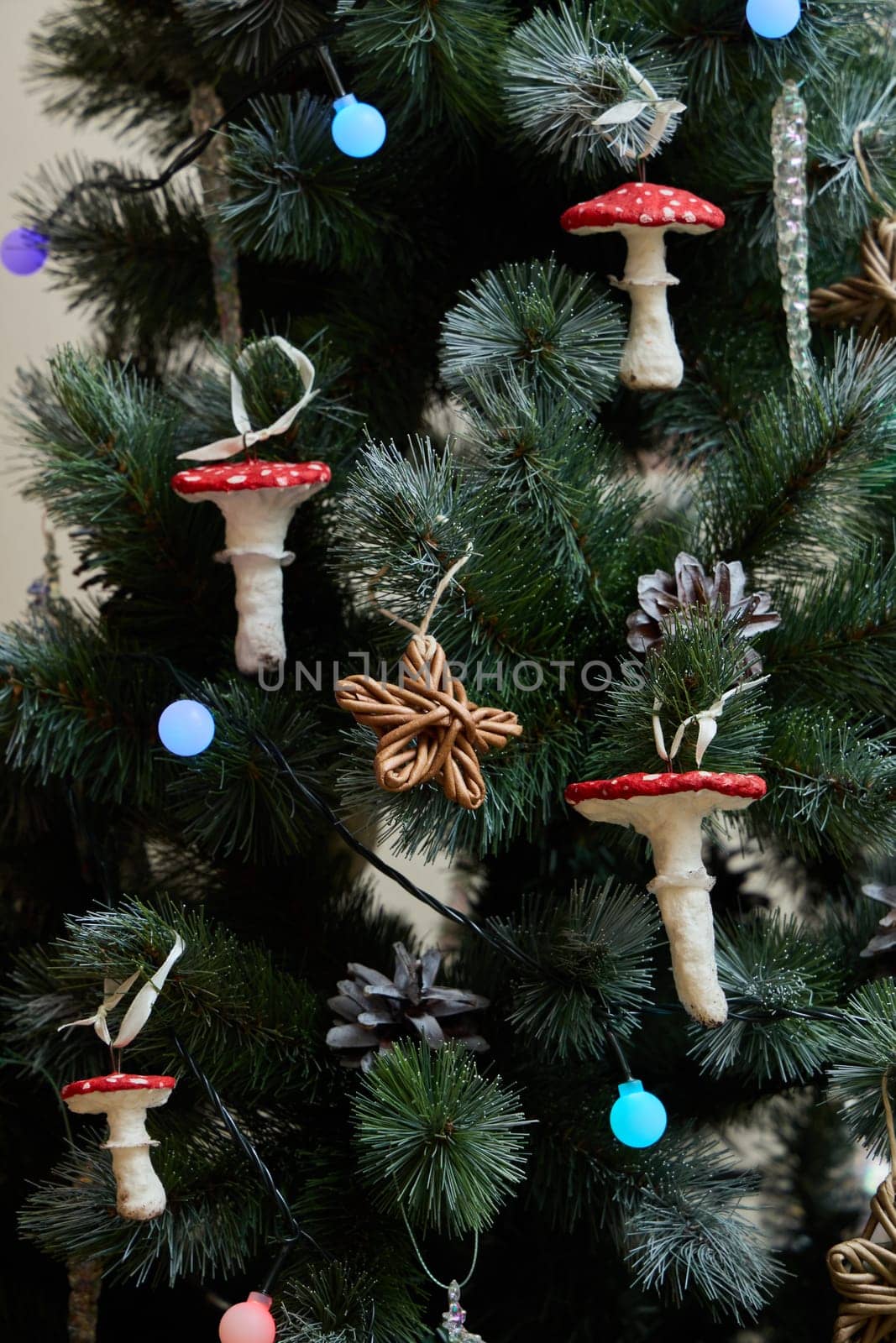Unique and charming holiday decorations that prominently feature colorful mushroom ornaments on a festive tree
