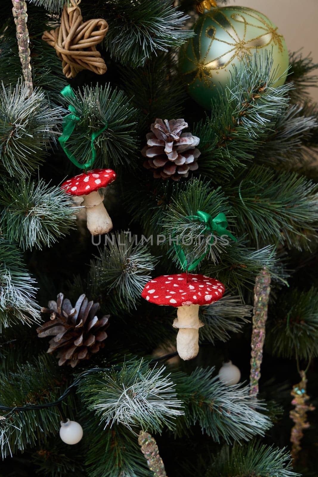 A beautifully decorated Christmas tree that features whimsical and delightful mushroom ornaments all around