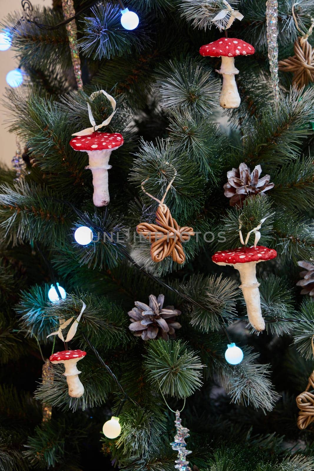 A beautifully festive Christmas tree elegantly adorned with delightful mushroom ornaments and lovely pinecones