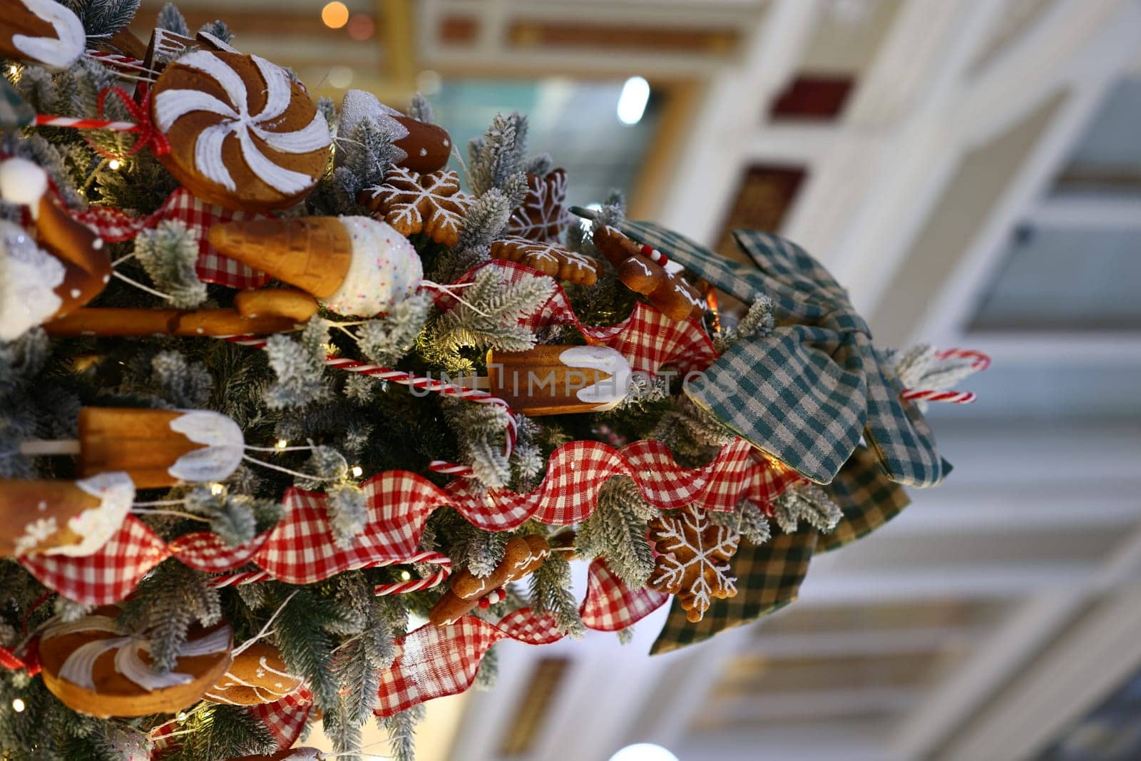 A beautifully adorned Christmas tree that showcases delightful candyinspired decorations and vibrant festive colors