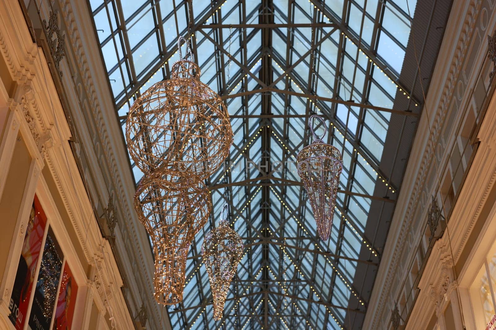 A stunning architectural view featuring a luxurious glass ceiling beautifully adorned with intricate decorations