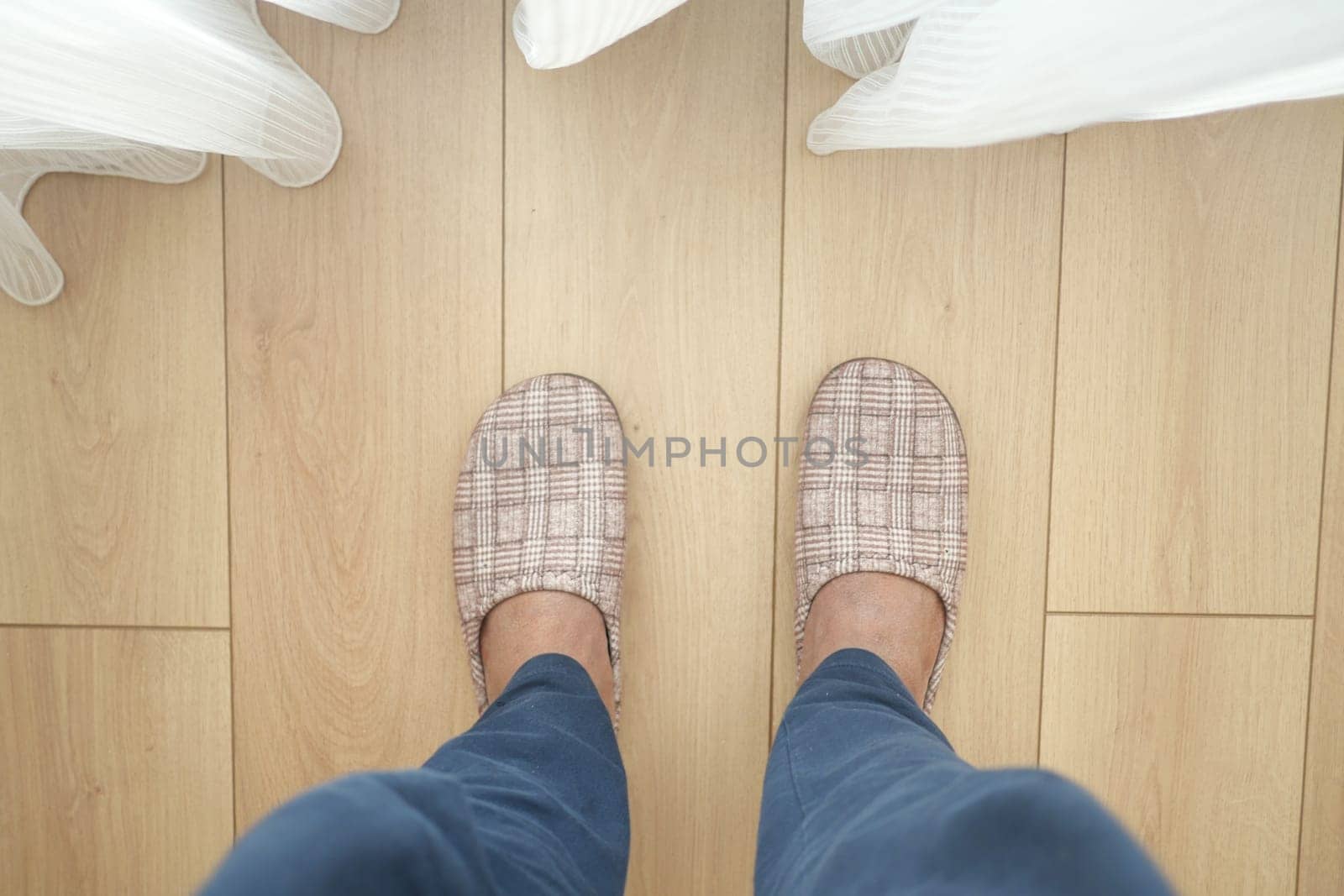 Cozy slippers on a stylish wooden floor, perfect for home comfort and relaxation