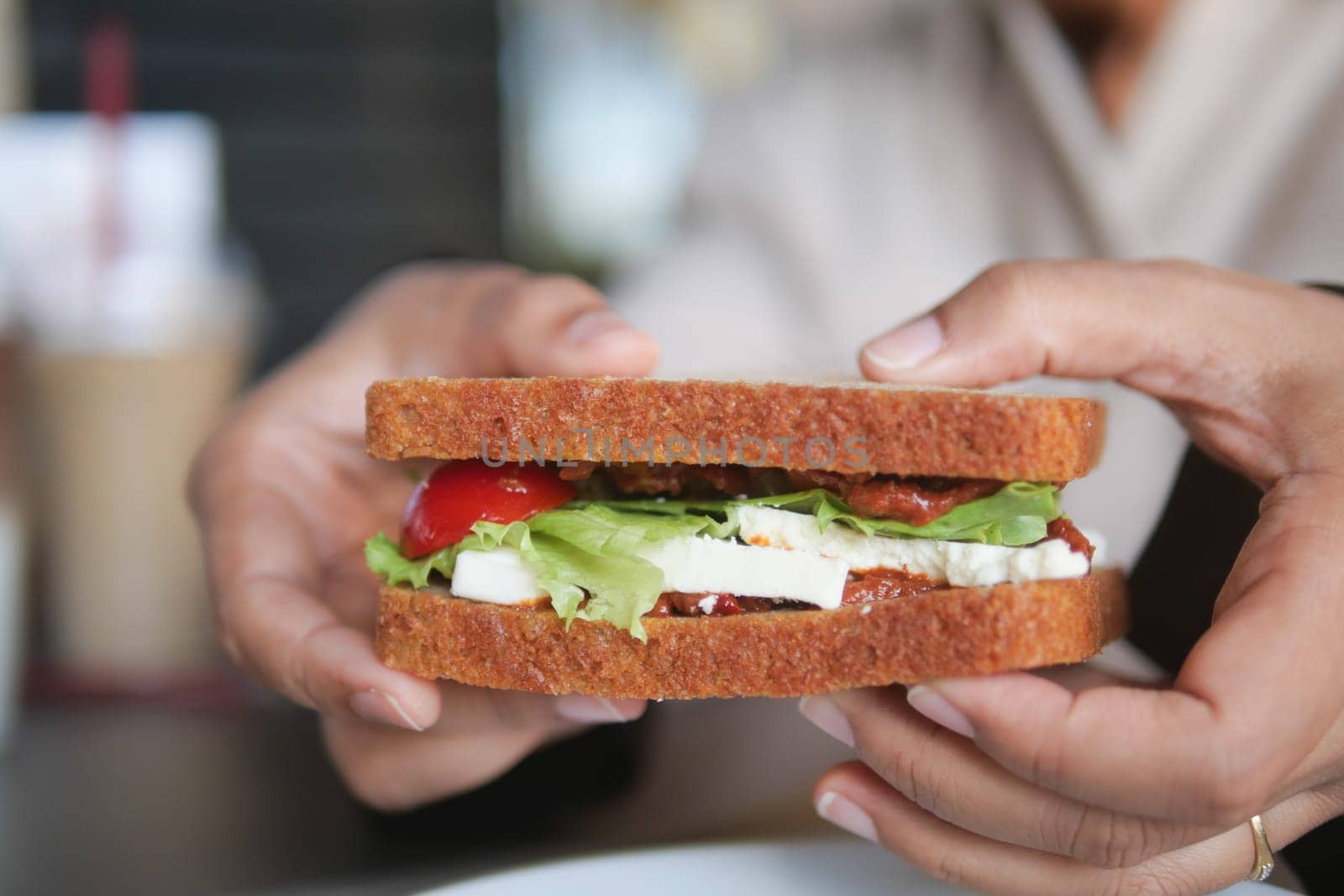 A delicious sandwich that is generously filled with a variety of fresh and vibrant ingredients