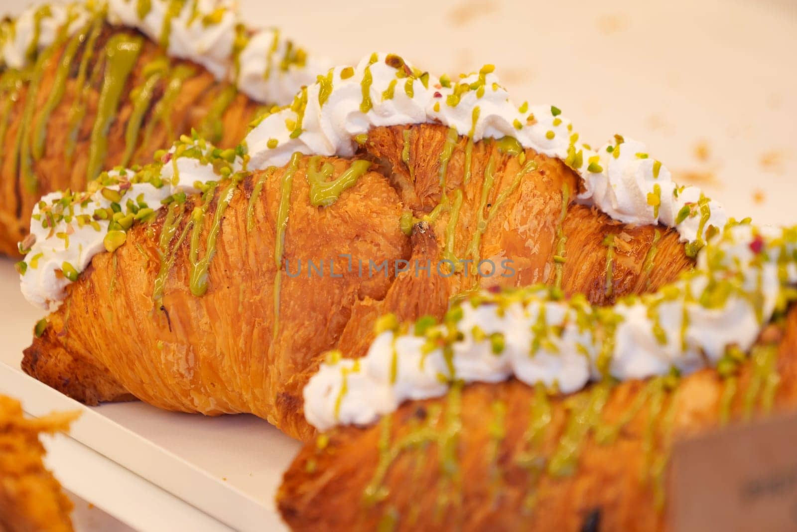 fresh baked croissant in a bakery .