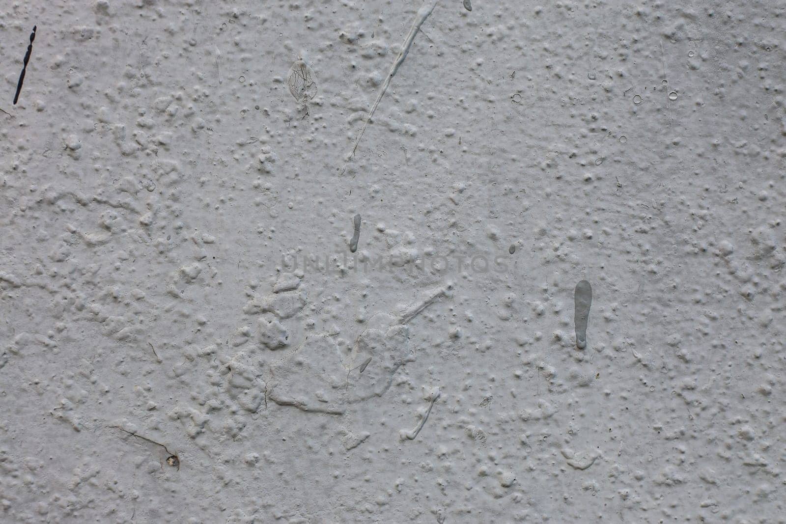 Surface of cement wall with uneven old plaster. Stone wall background.
