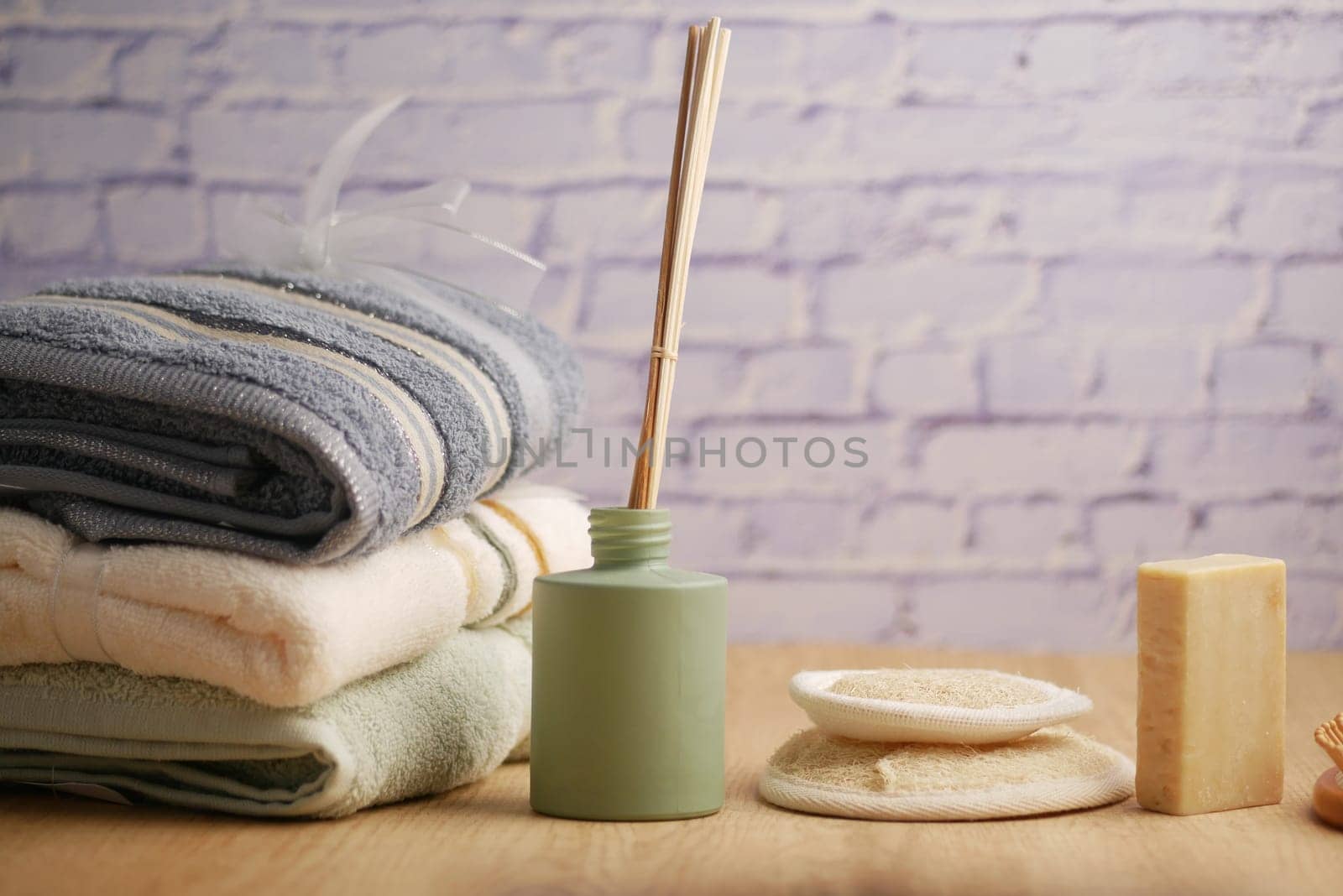Relaxing spa essentials arranged with soft towels and natural soap for a serene experience