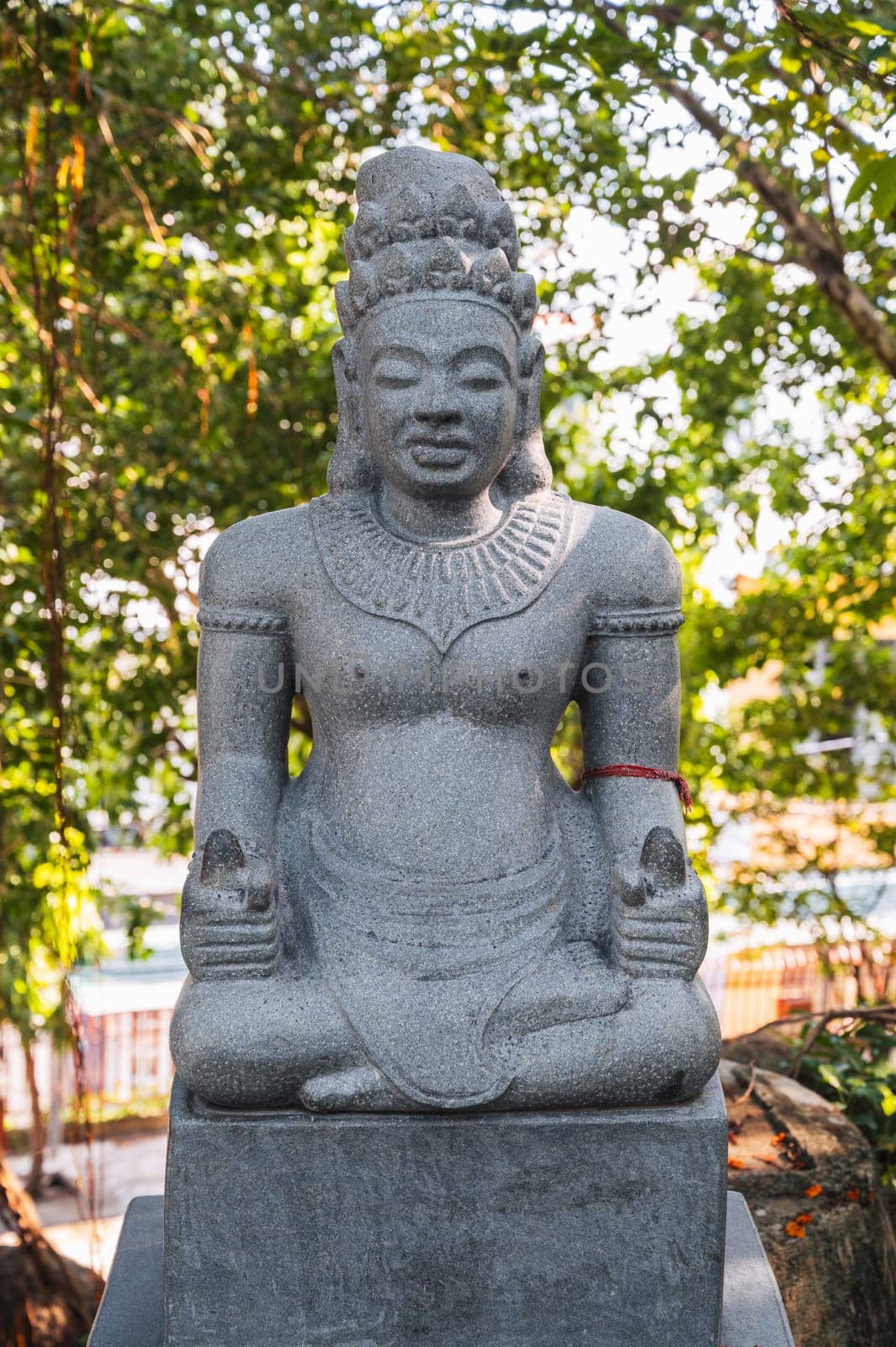 statue of a female deity in the park at Buddhist pagoda at the Cham Towers in Nha Trang, Vietnam