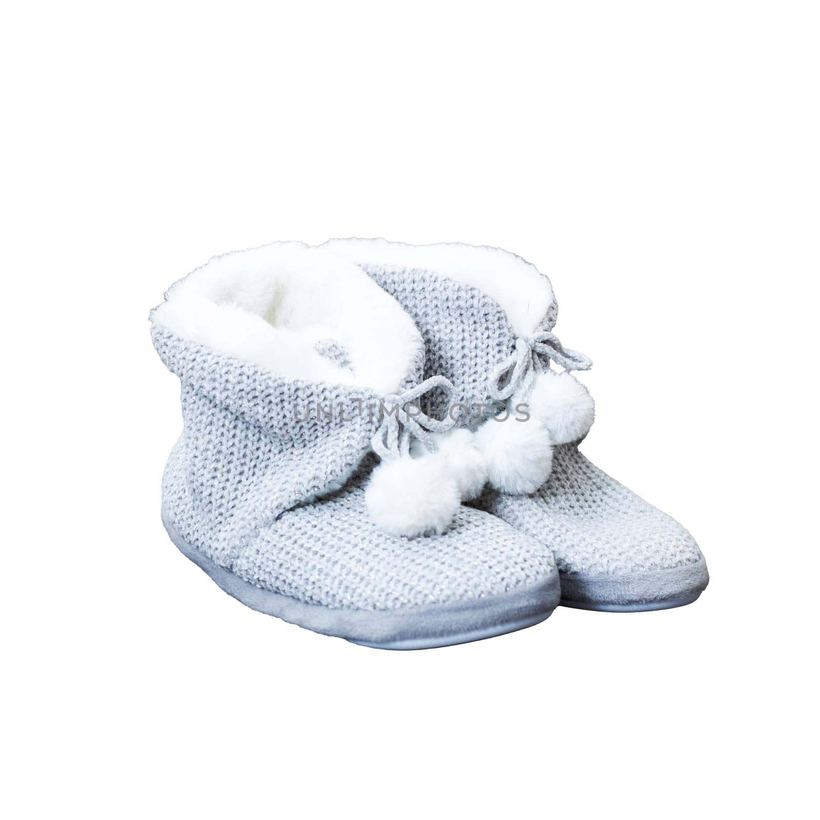 A lovely pair of gray slippers adorned with fluffy white pom poms sitting elegantly on a pristine white background