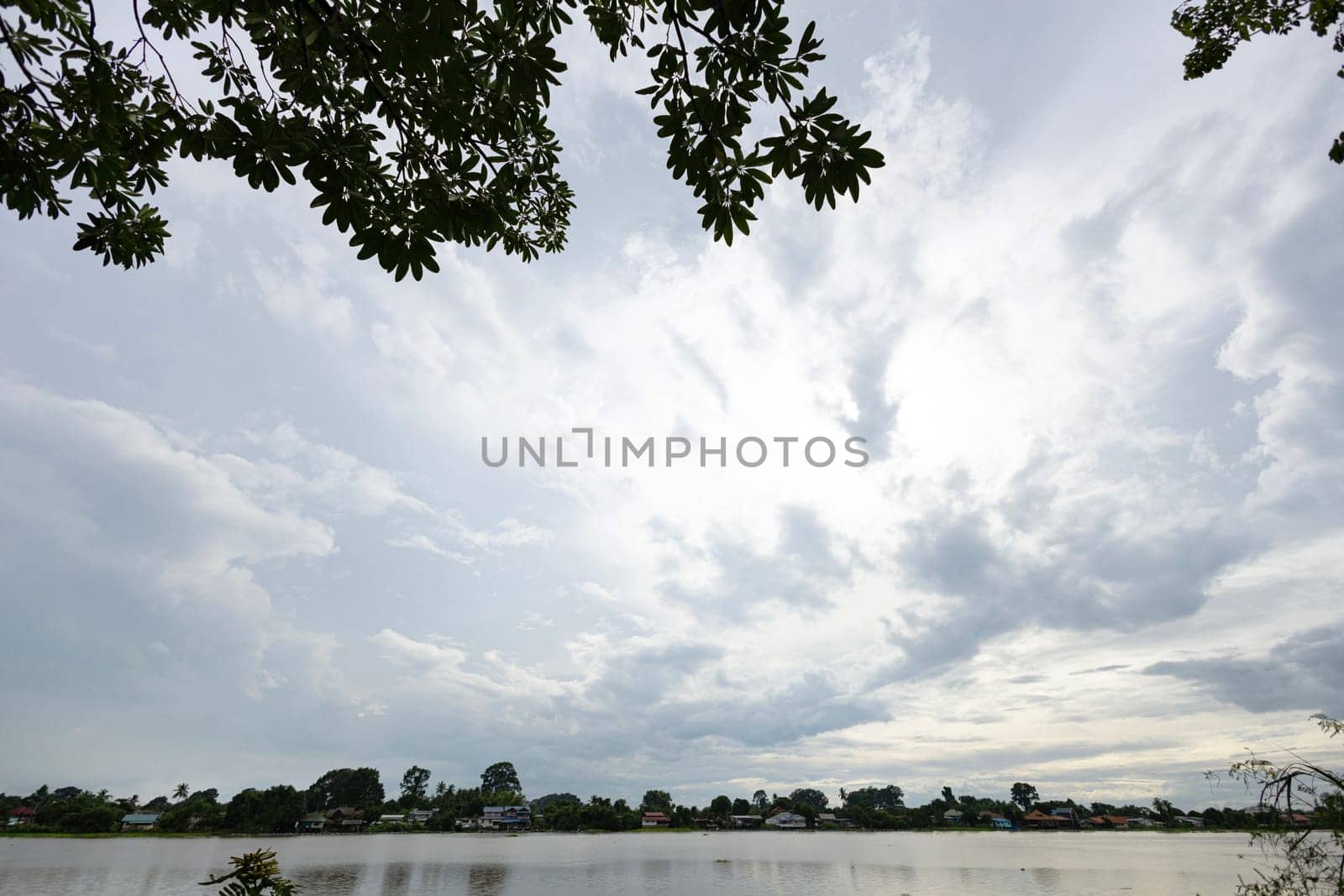 River Landscape with cloudy sky. Wild river nature cloudscape by summer day.