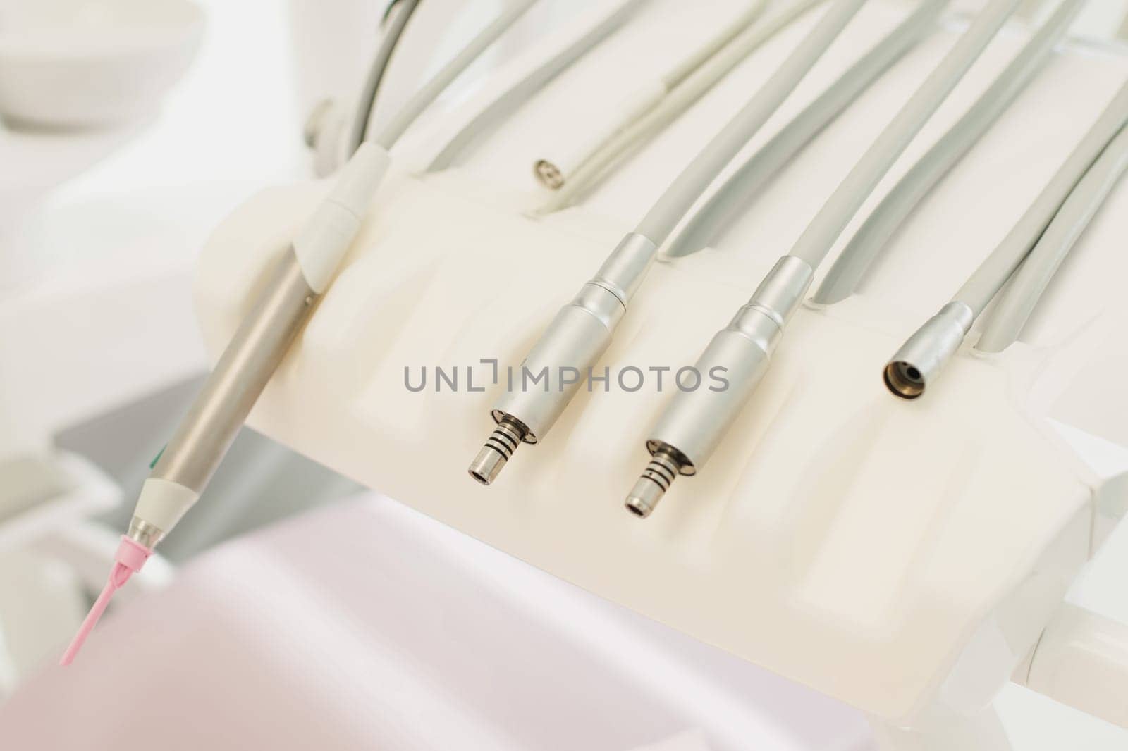 Dental tools, drill macro top view teal glow
