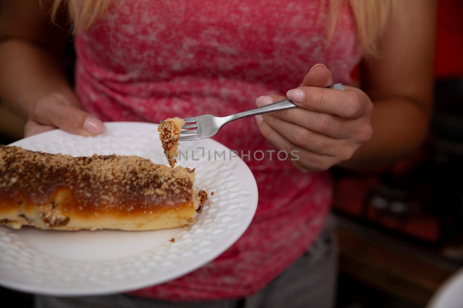 A person savoring a delectable and tempting dessert, showcasing indulgence and a culinary delight experience