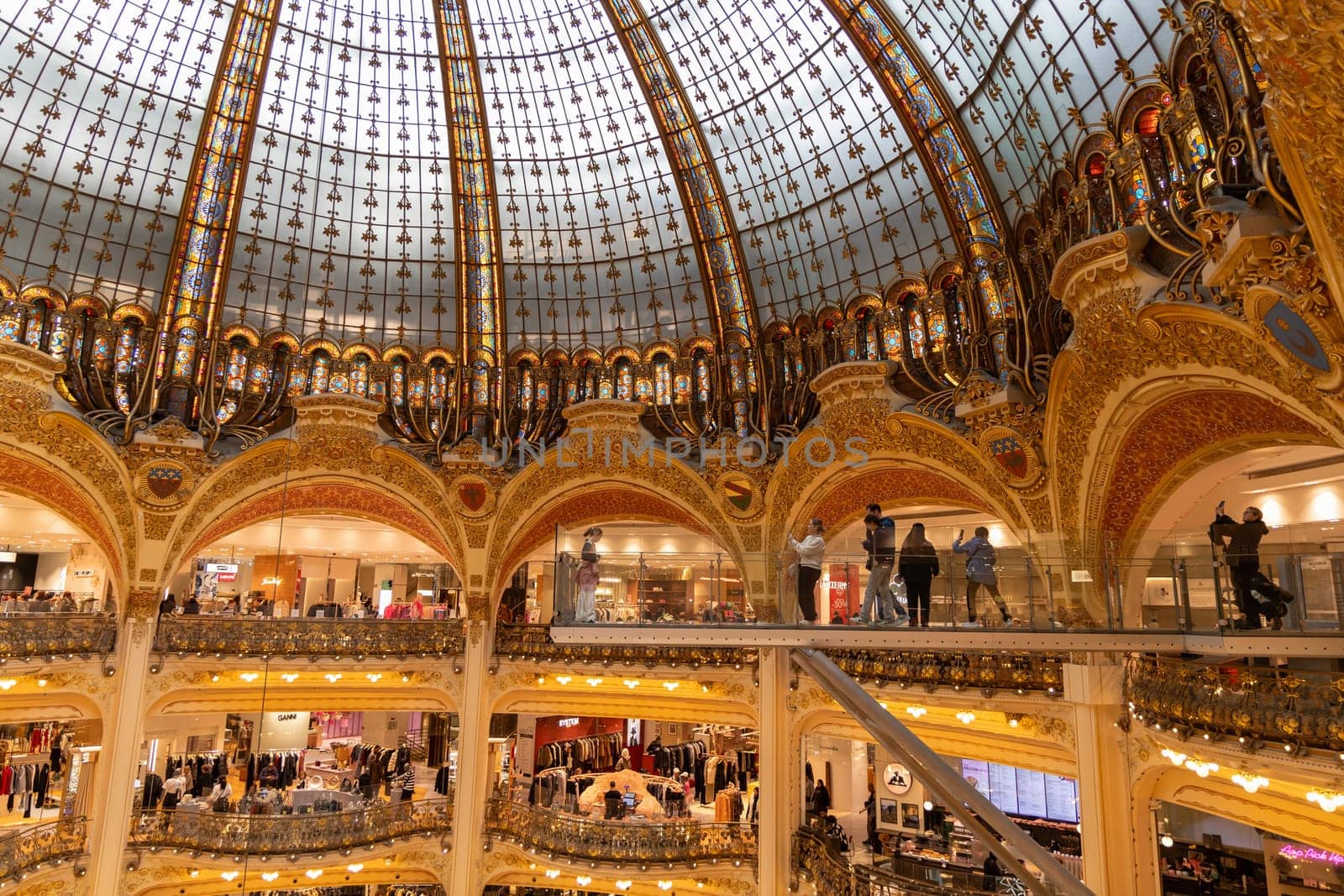 Explore the grandeur of Galeries Lafayette, a famous shopping destination in Paris, showcasing beautiful architecture. Paaris, France - October 24, 2024