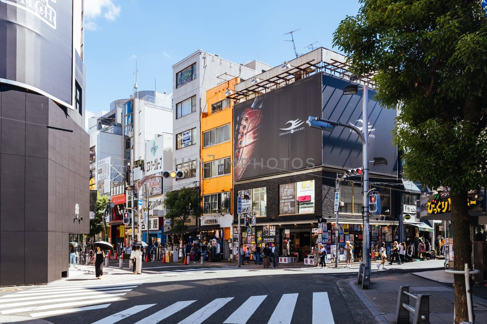 OSAKA, JAPAN - SEPTEMBER 26 2024: The trendy and fashionable Amerikamura district on a clear autumn day in Osaka, Japan