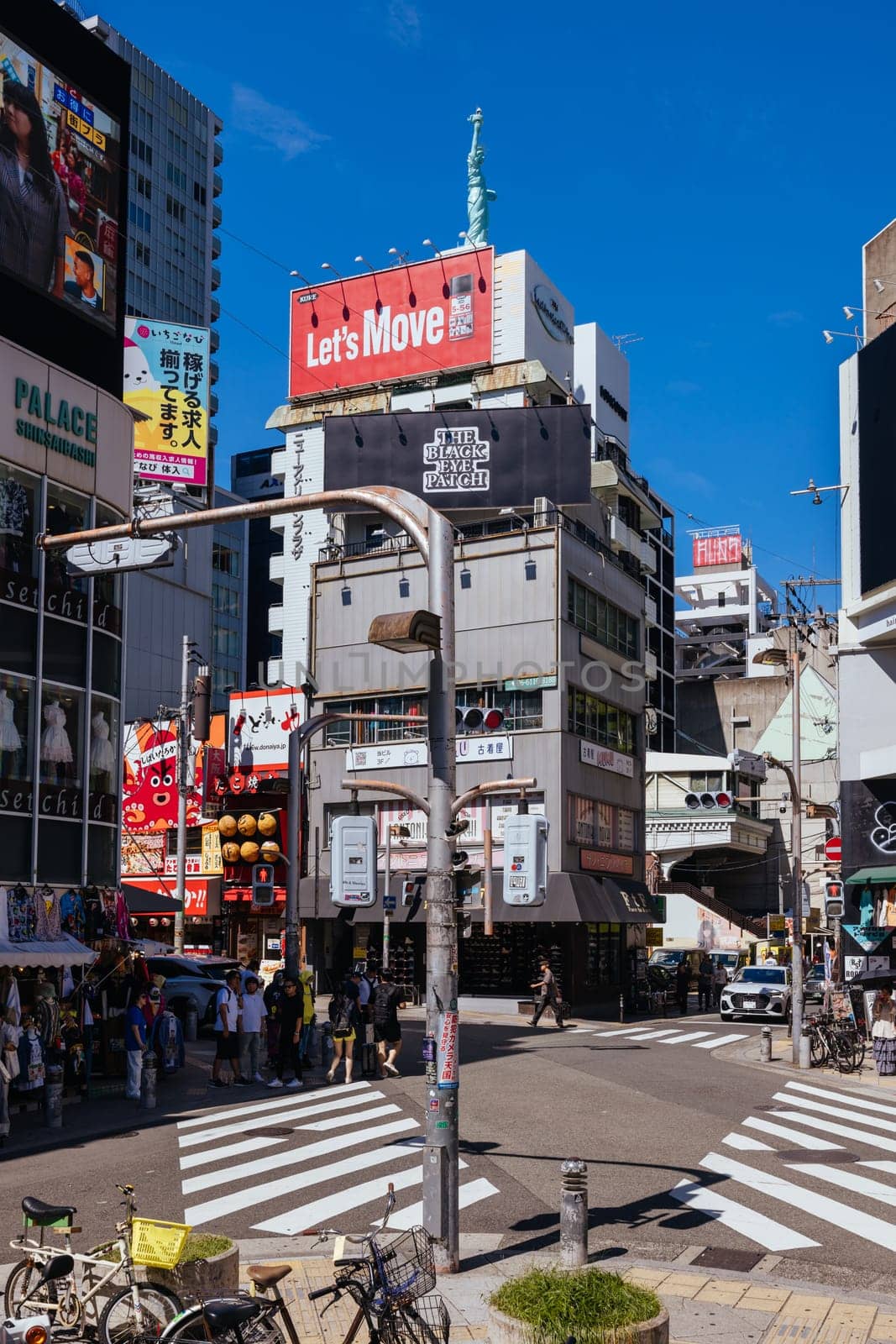 OSAKA, JAPAN - SEPTEMBER 26 2024: The trendy and fashionable Amerikamura district on a clear autumn day in Osaka, Japan