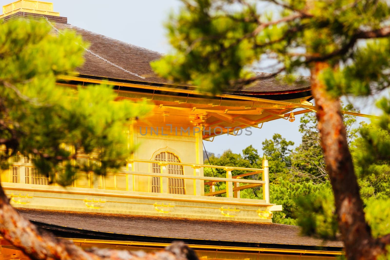 The world famous Kinkakuji Temple (The Golden Pavilion) in Kyoto, Japan on a warm autumn morning