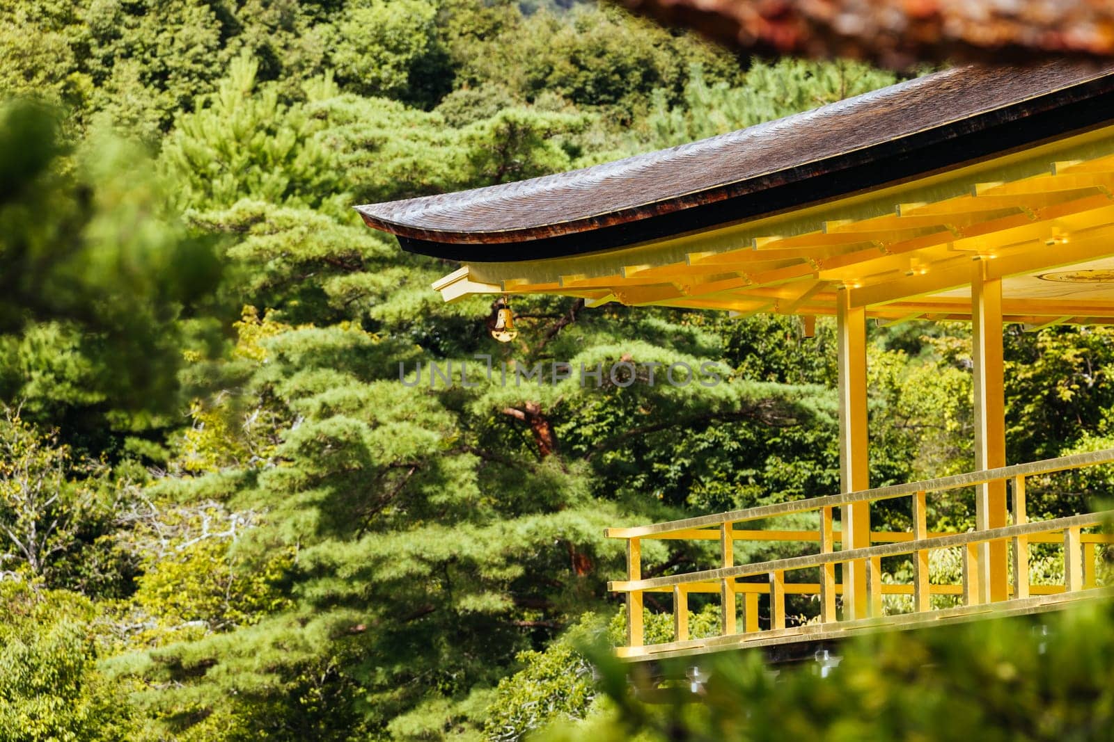 The world famous Kinkakuji Temple (The Golden Pavilion) in Kyoto, Japan on a warm autumn morning