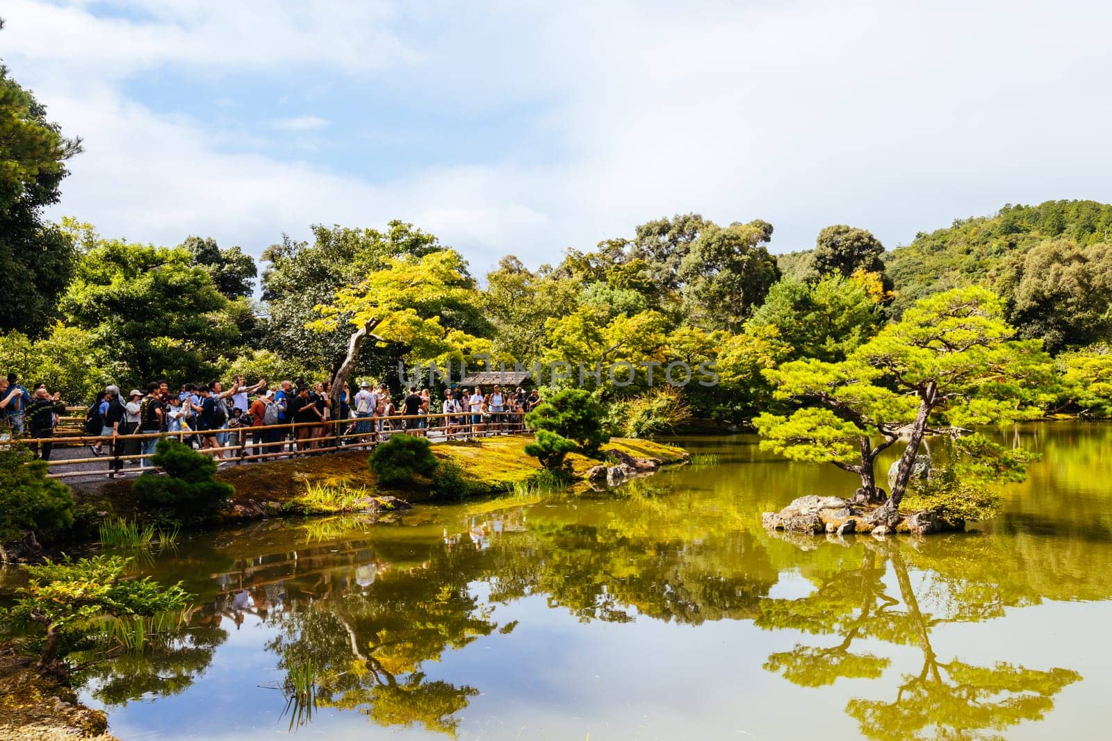 The world famous Kinkakuji Temple (The Golden Pavilion) in Kyoto, Japan on a warm autumn morning