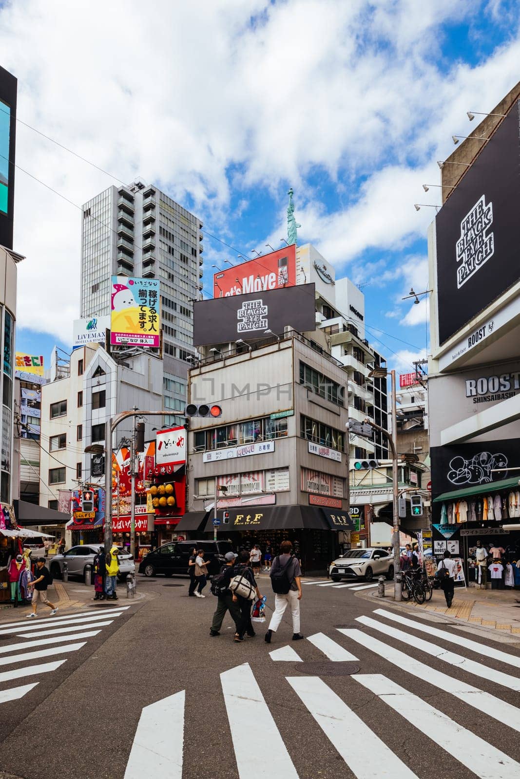 OSAKA, JAPAN - SEPTEMBER 26 2024: The trendy and fashionable Amerikamura district on a clear autumn day in Osaka, Japan