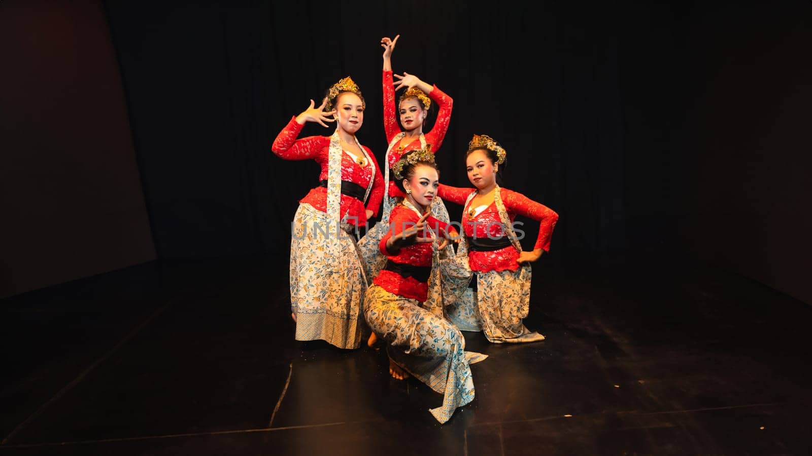 A group of traditional Balinese dancers showed the harmony of the dancers' movements in red uniforms creating stunning visuals on stage