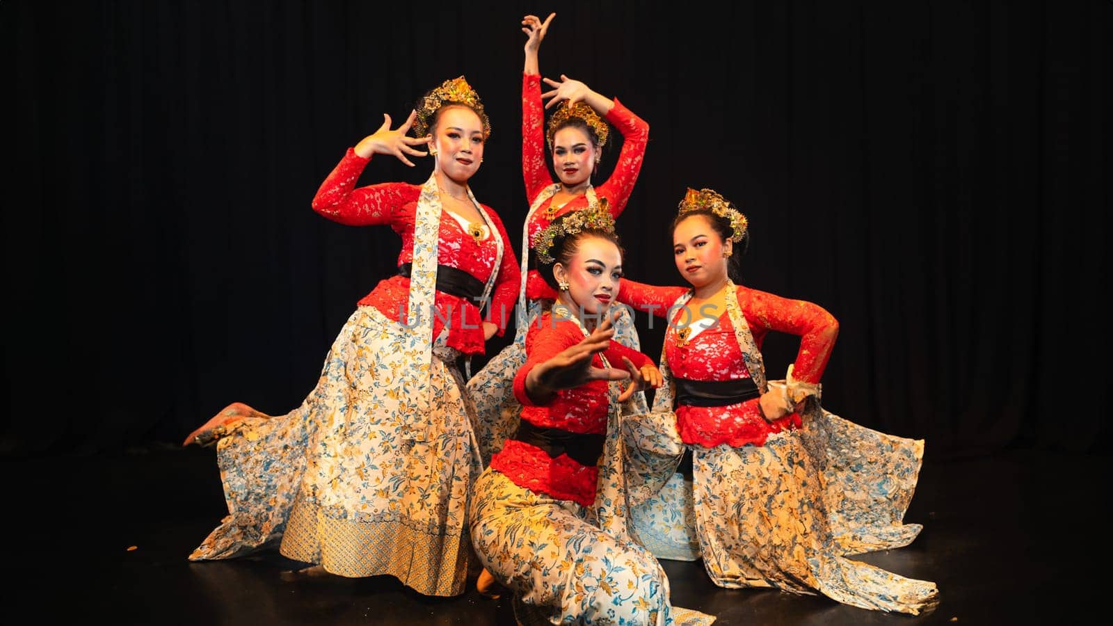 A group of traditional Balinese dancers showed the harmony of the dancers' movements in red uniforms creating stunning visuals on stage