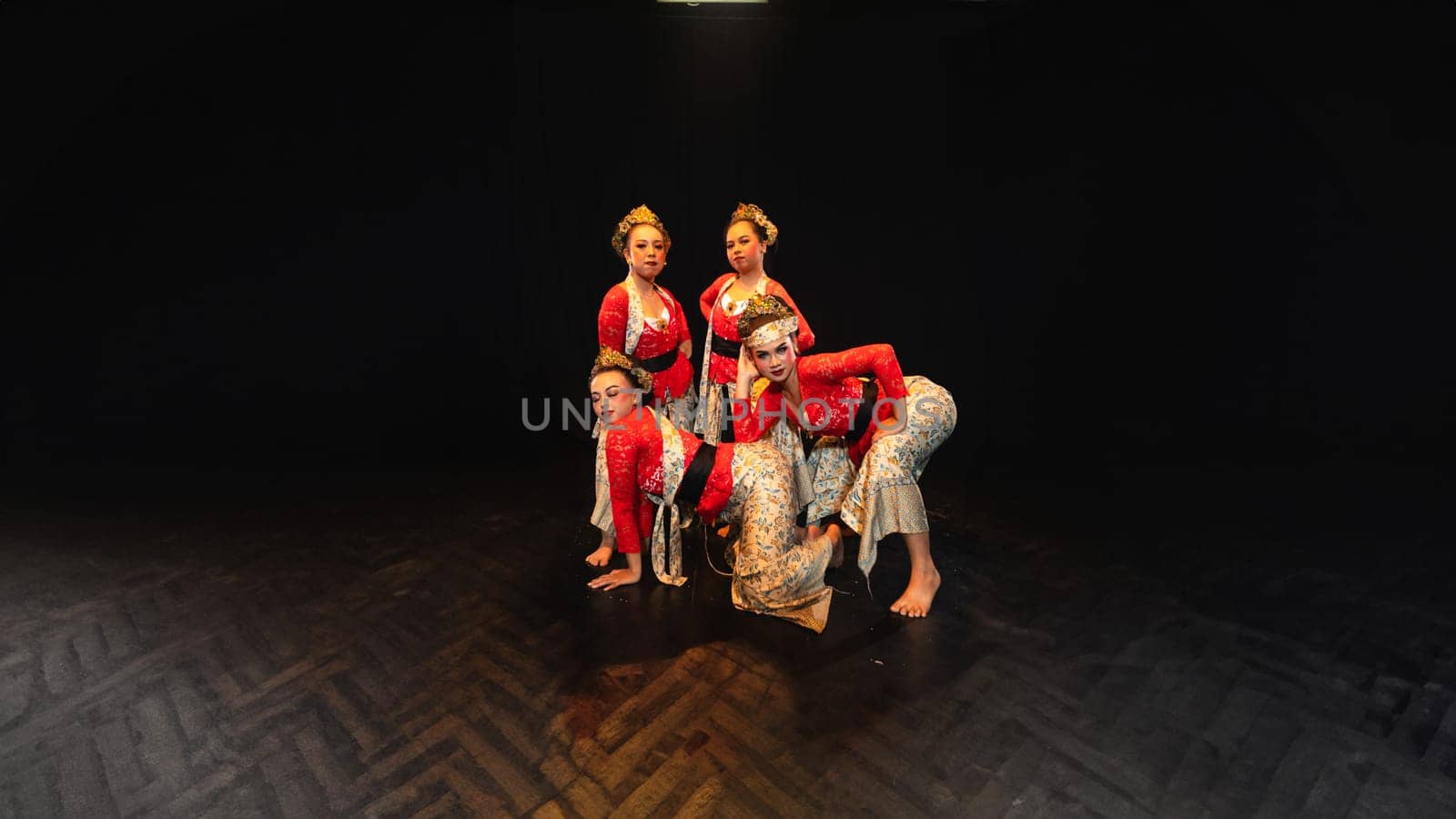 A group of traditional Balinese dancers showed the harmony of the dancers' movements in red uniforms creating stunning visuals on stage
