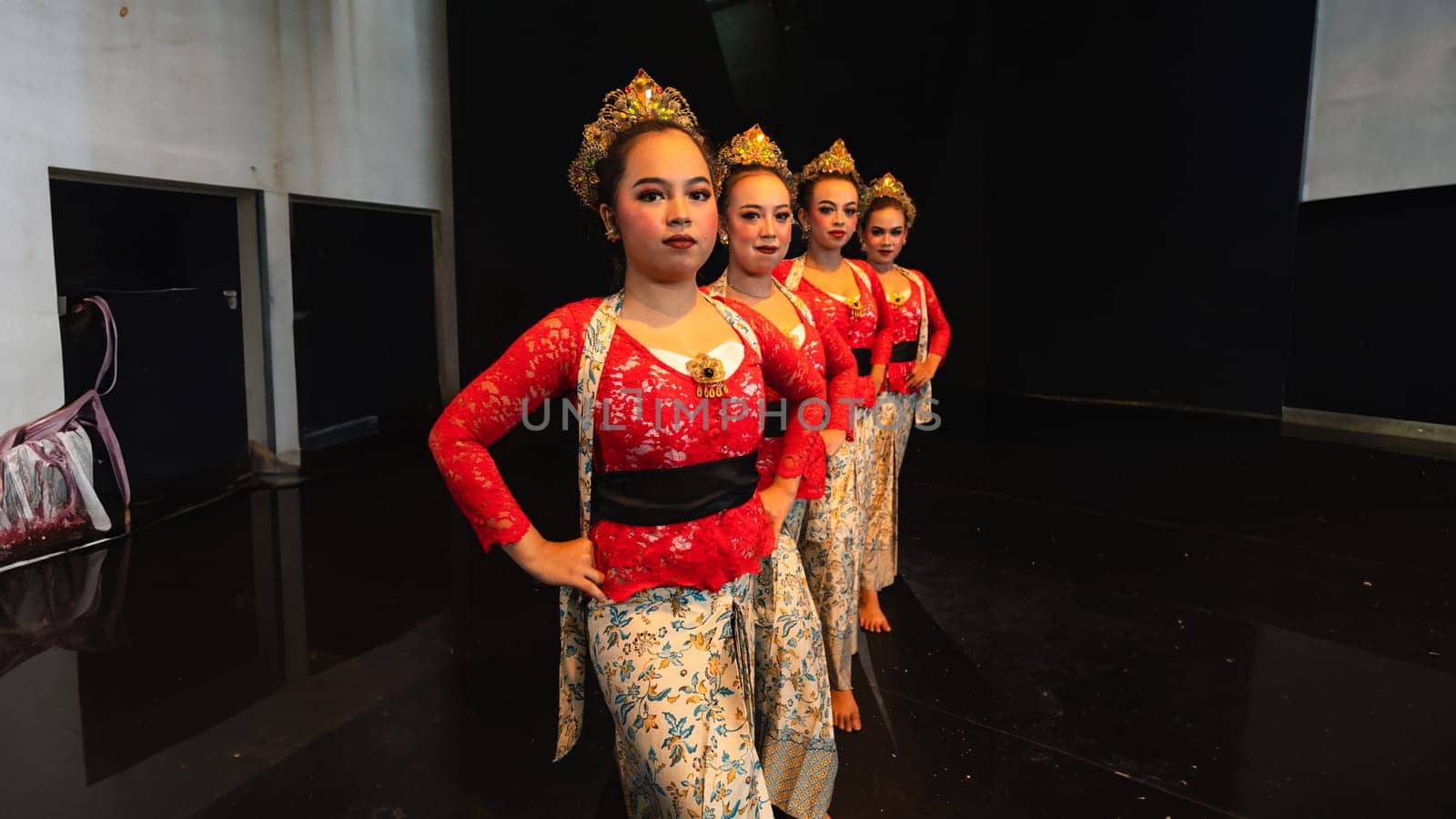 A group of traditional Balinese dancers showed the harmony of the dancers' movements in red uniforms creating stunning visuals on stage