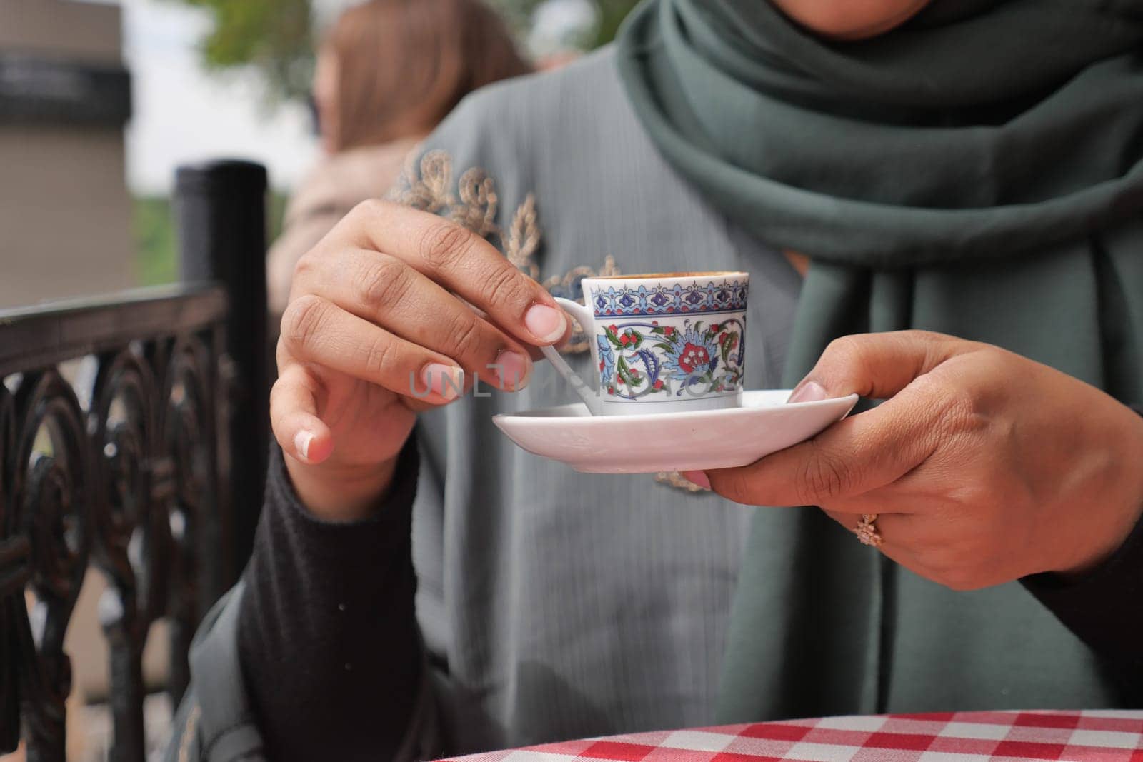 women drinking a cup of turkish coffee by towfiq007