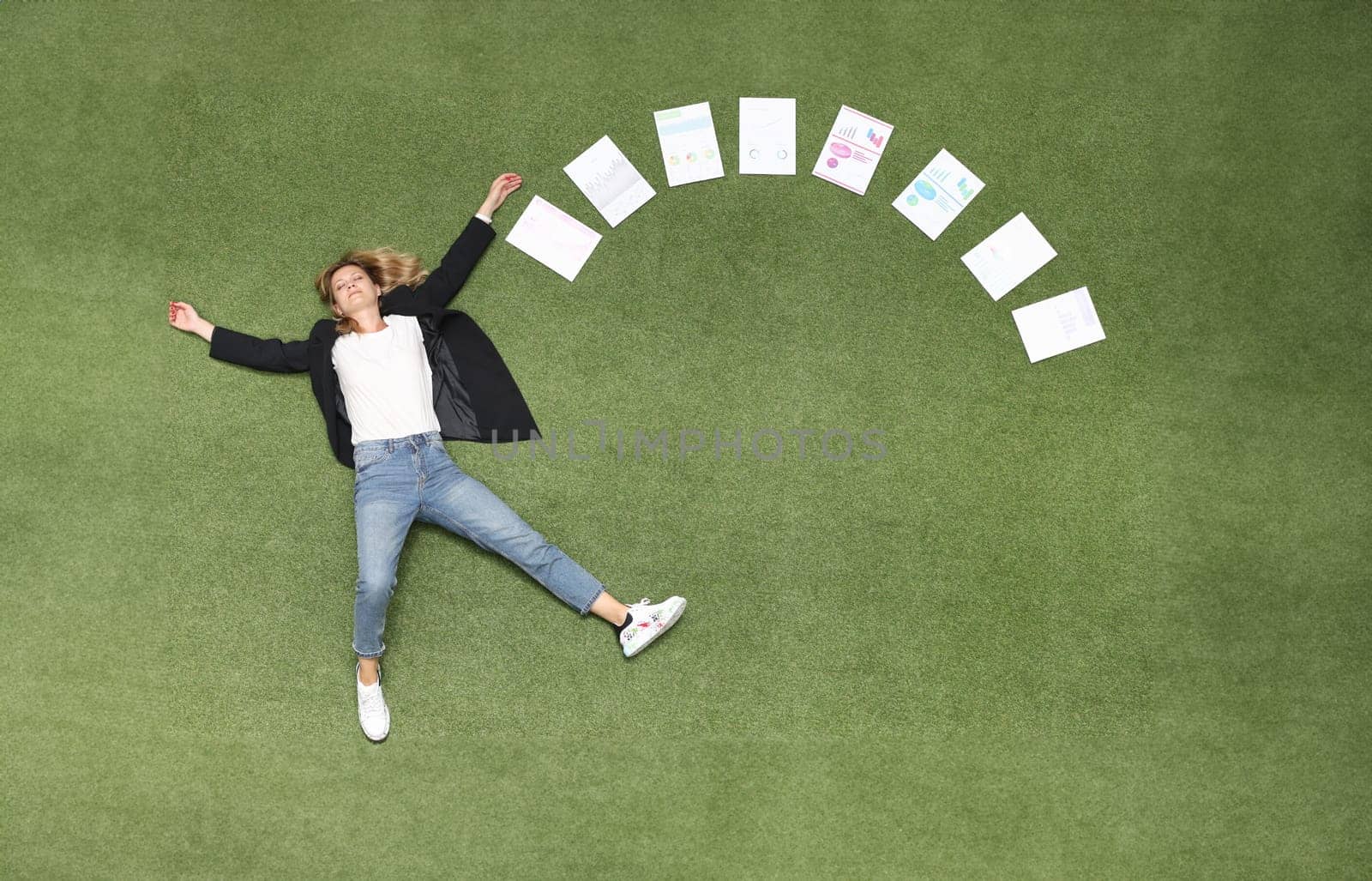 Woman is lying on green lawn along with chart business analytics. Advertising business banner place for text
